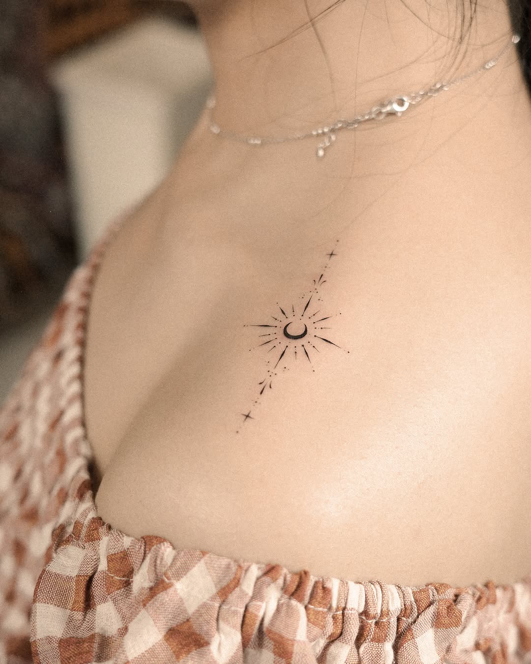 Sun and moon with stars ornamental tattoo on the chest by Easy