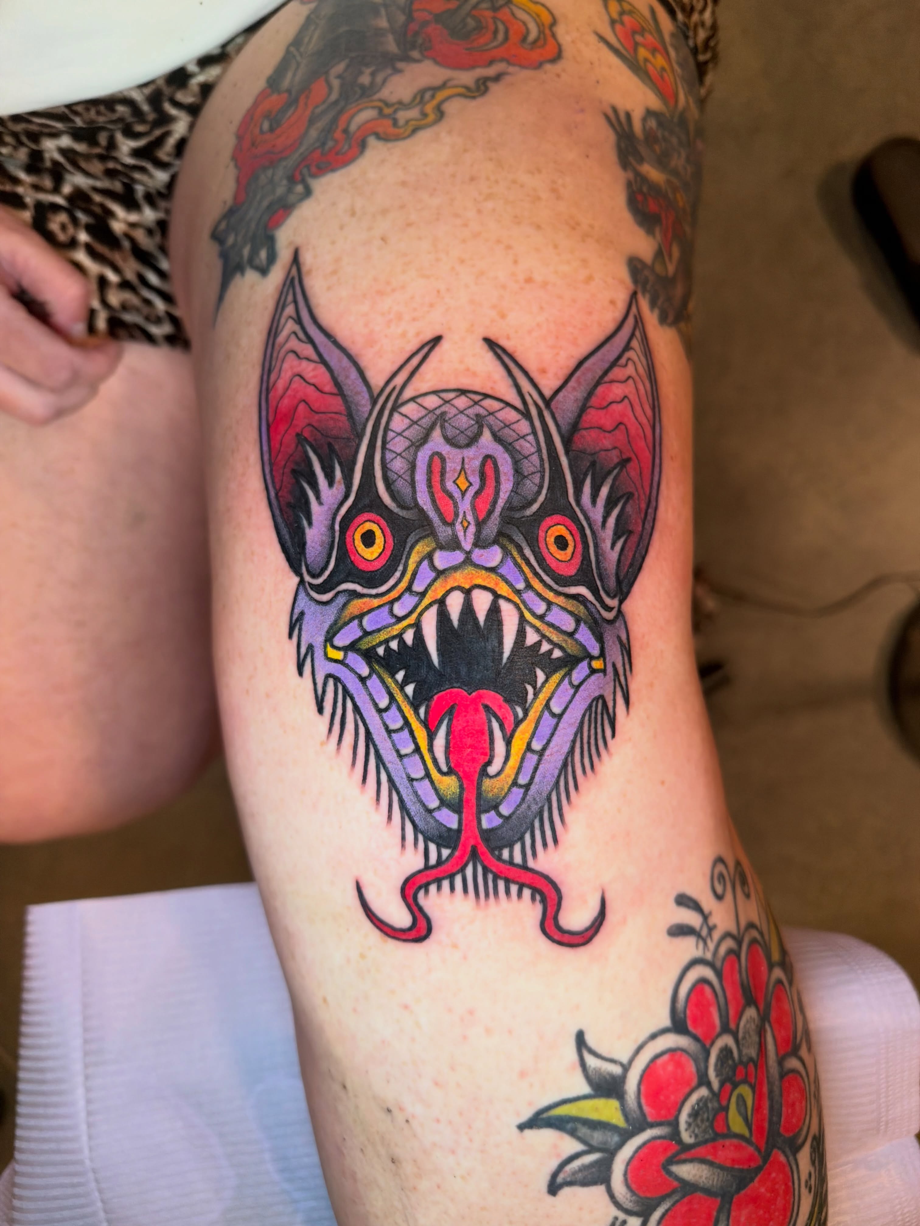 Demon head American traditional tattoo on the thigh by @ryanpereztattoo
