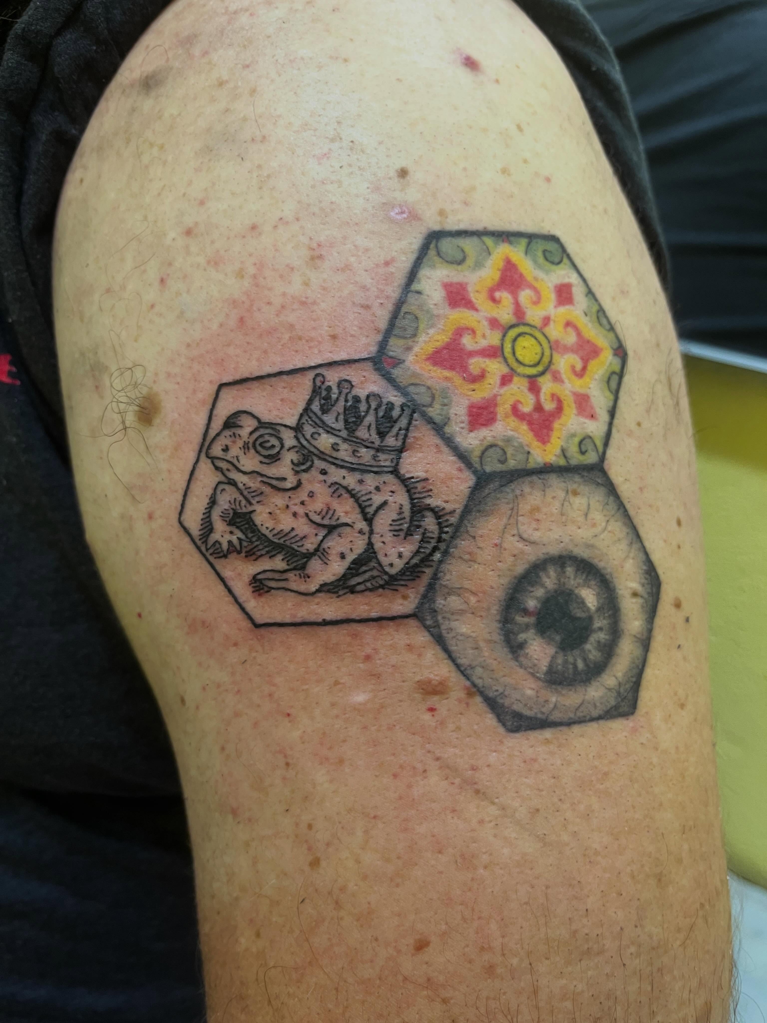 Frog with crown American traditional tattoo on the shoulder by Rafaela Lopez