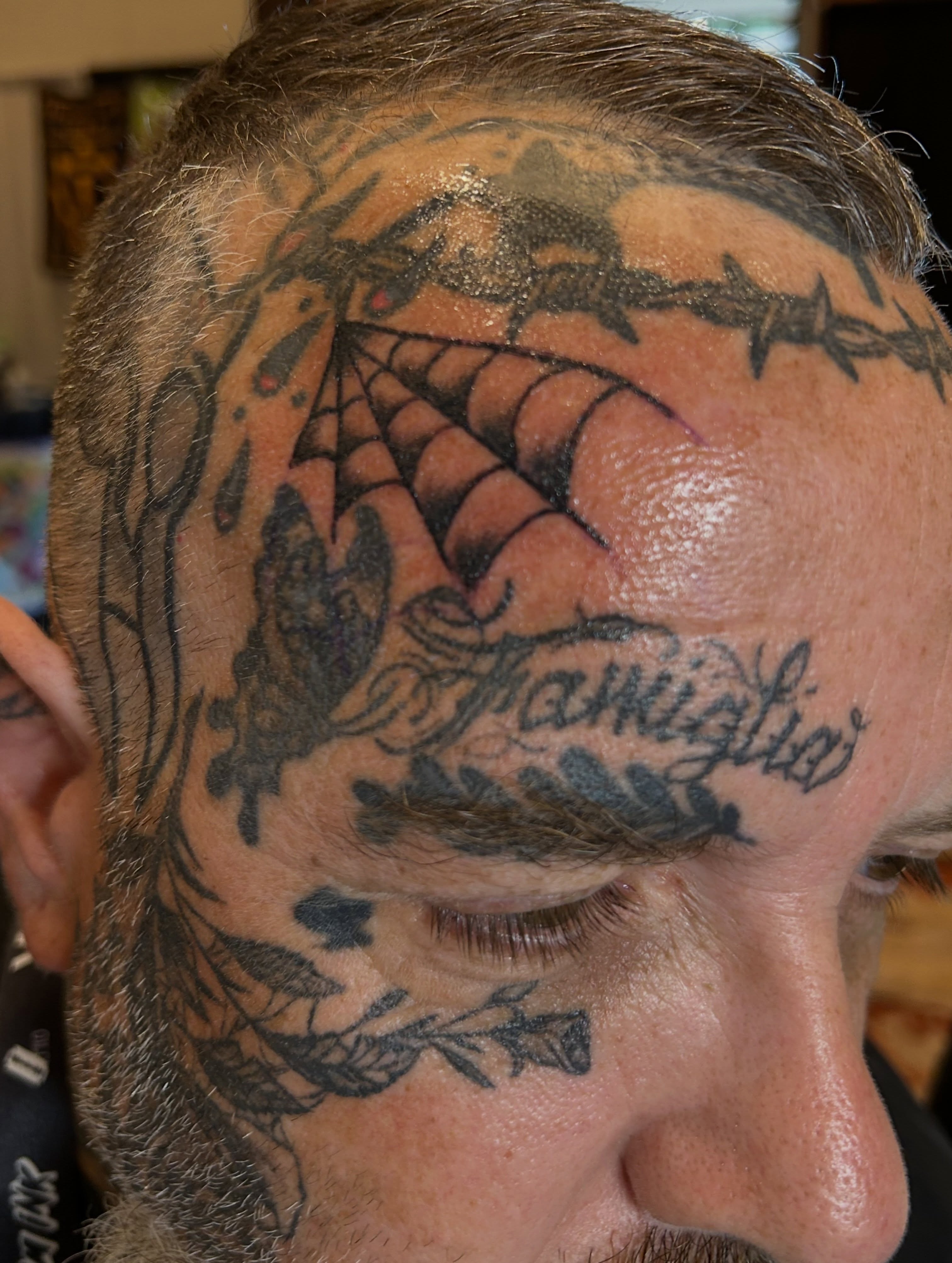 Spider web black and grey tattoo on the head by Erik Sacony