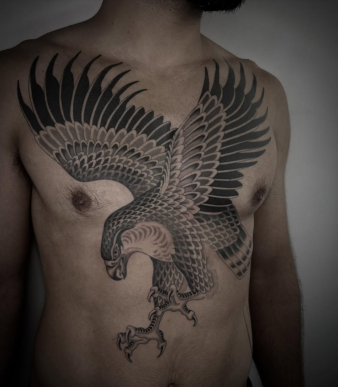 Eagle fine line tattoo on the chest by linahsiaotattoo