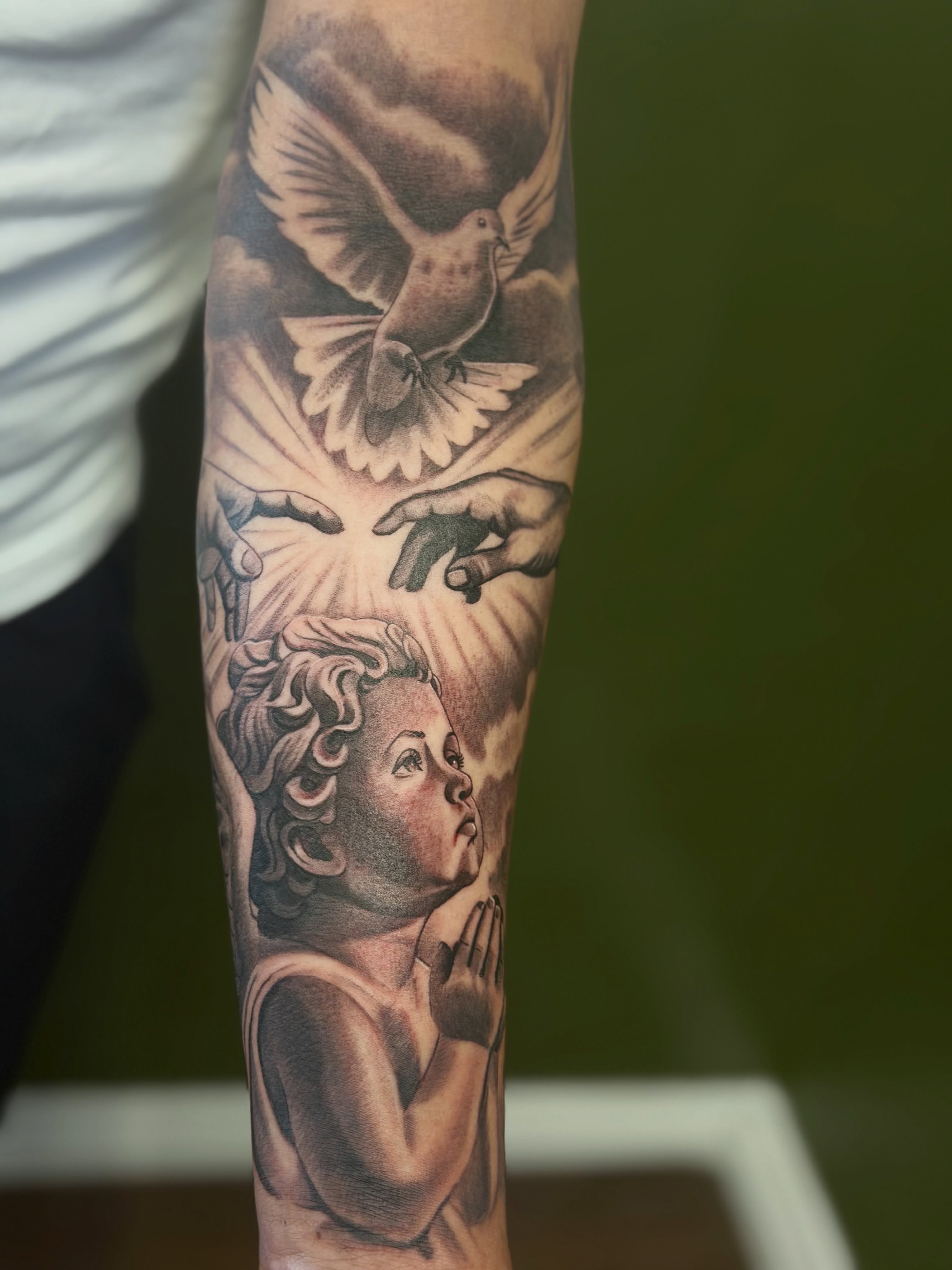 Child praying realism tattoo on the forearm by Vic