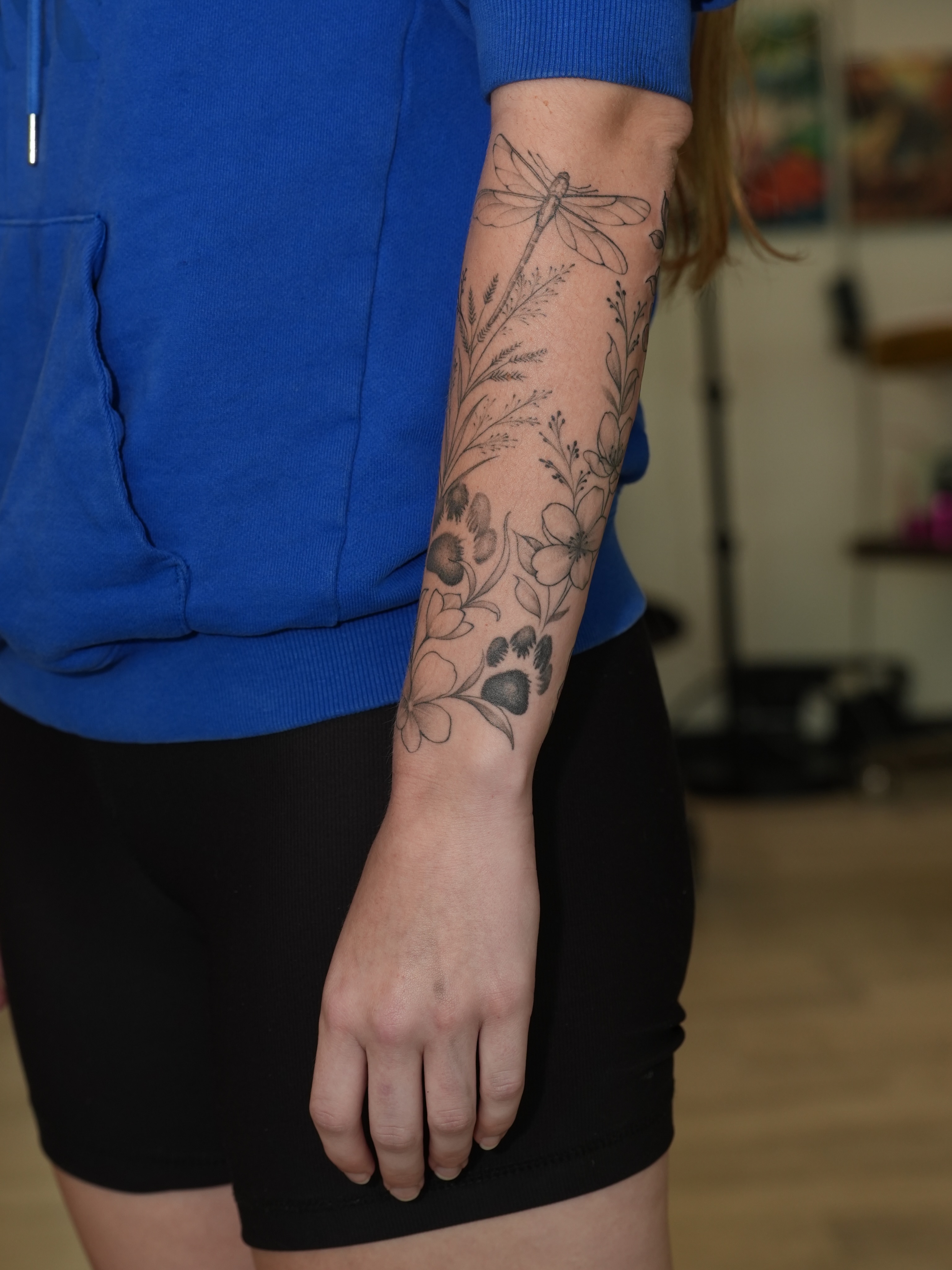 Floral arrangement black and grey tattoo on the forearm by Kevin Betancourt