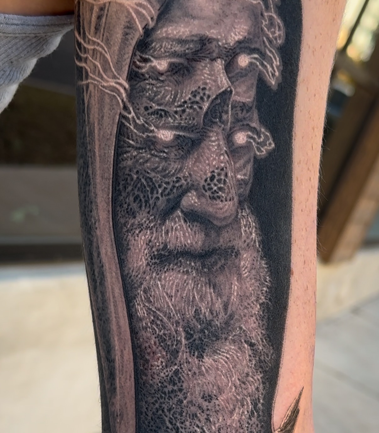 Bearded man dotwork tattoo on the forearm by Dan Sprague