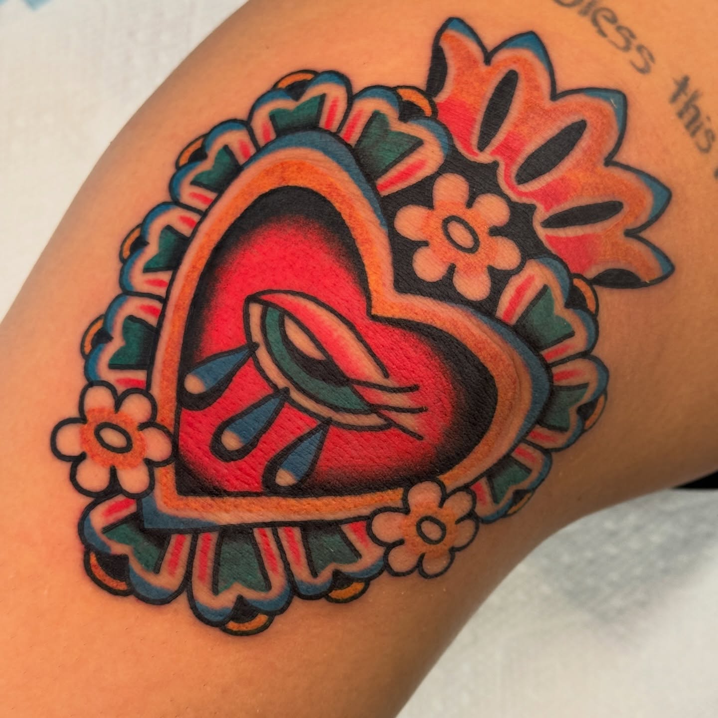 Heart with ribbon American traditional tattoo on the forearm by Rafael Torres, San Francisco, California