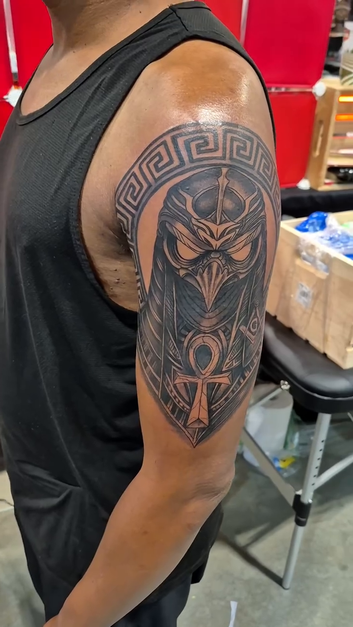 Egyptian hawk-headed deity with ankh realism tattoo by Chris TL Jones