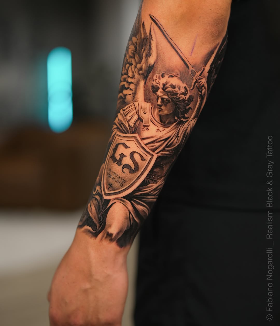 Tattoo by @nogarolli_tattoo — realism, black_and_grey