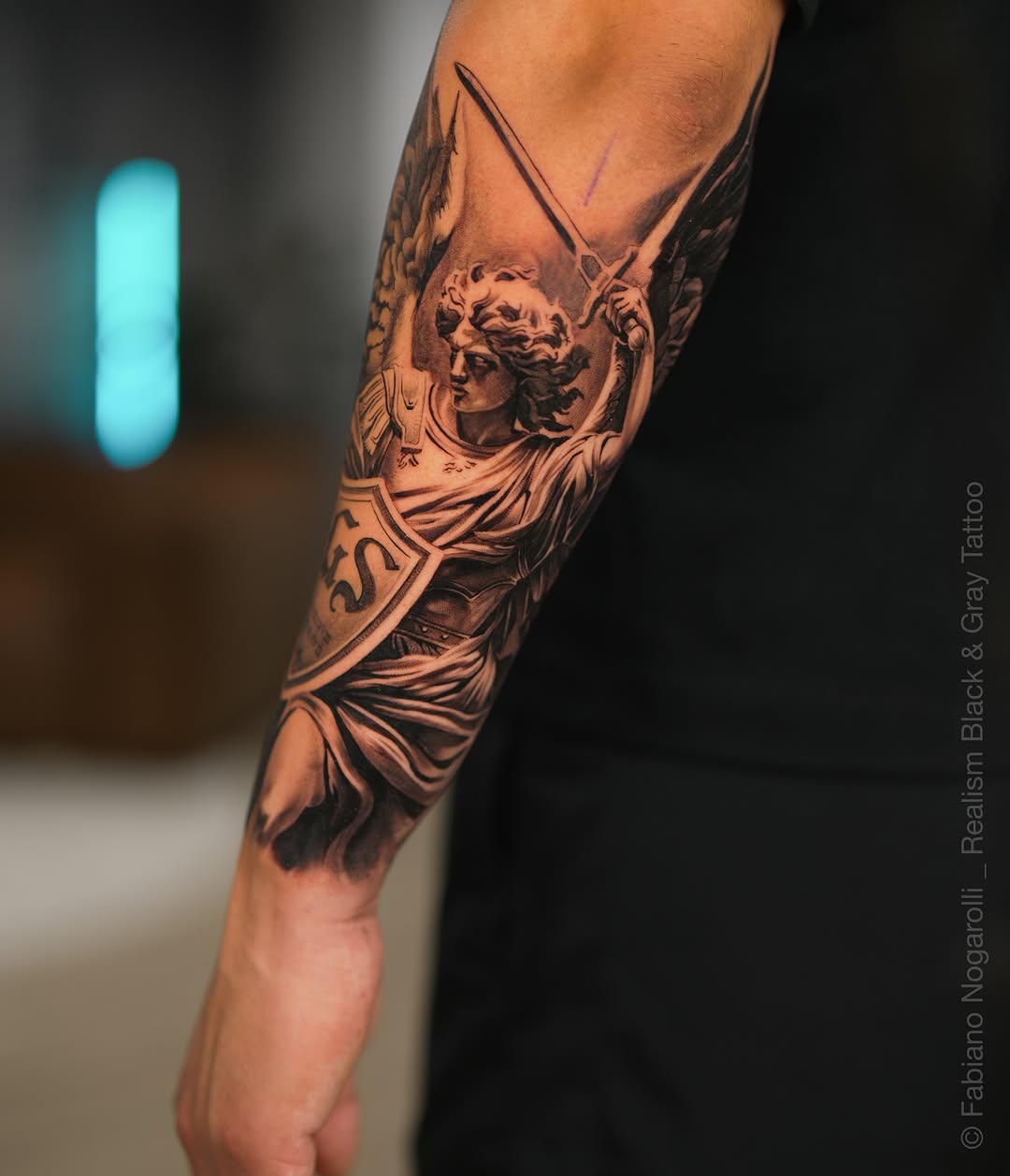 Tattoo by @nogarolli_tattoo — realism, black_and_grey
