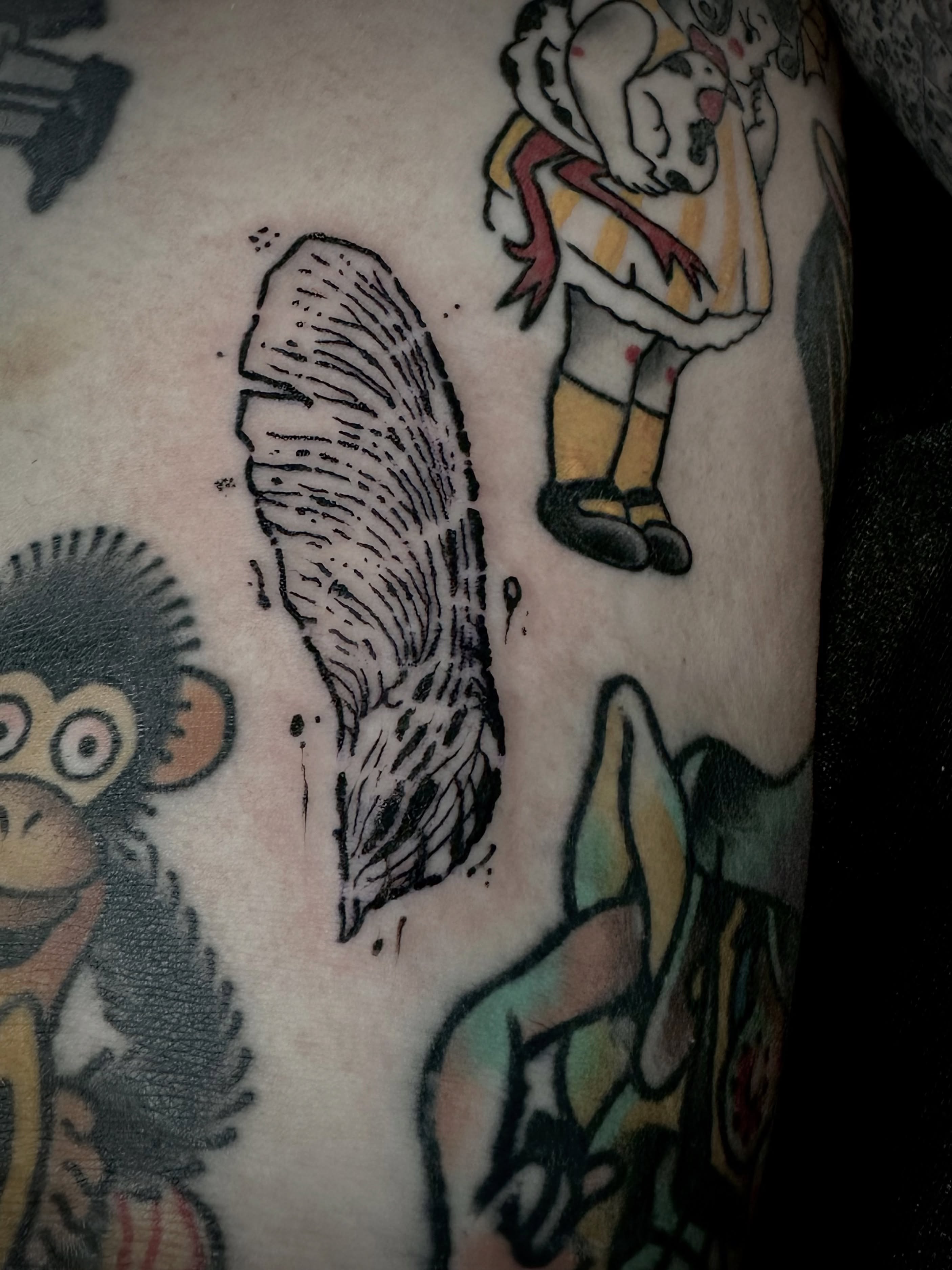 Feather American traditional tattoo on the forearm by Noah Durany
