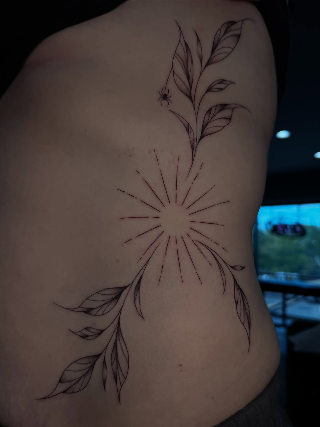 Sunburst with vine and spider ornamental tattoo on the back by 𝔍𝔲𝔩𝔦𝔞, New York, New York