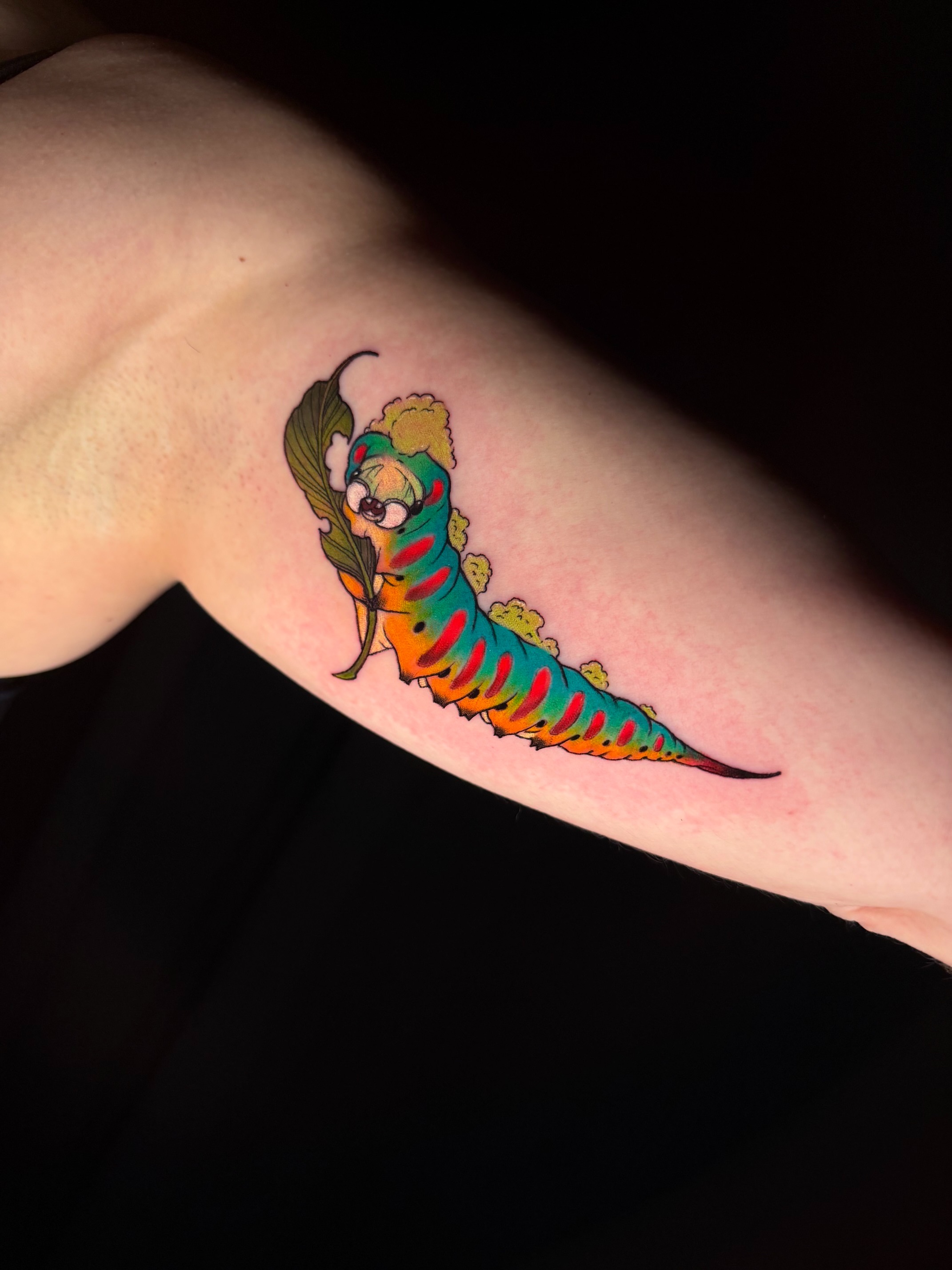 Worm new school tattoo on the forearm by Christel Perkins