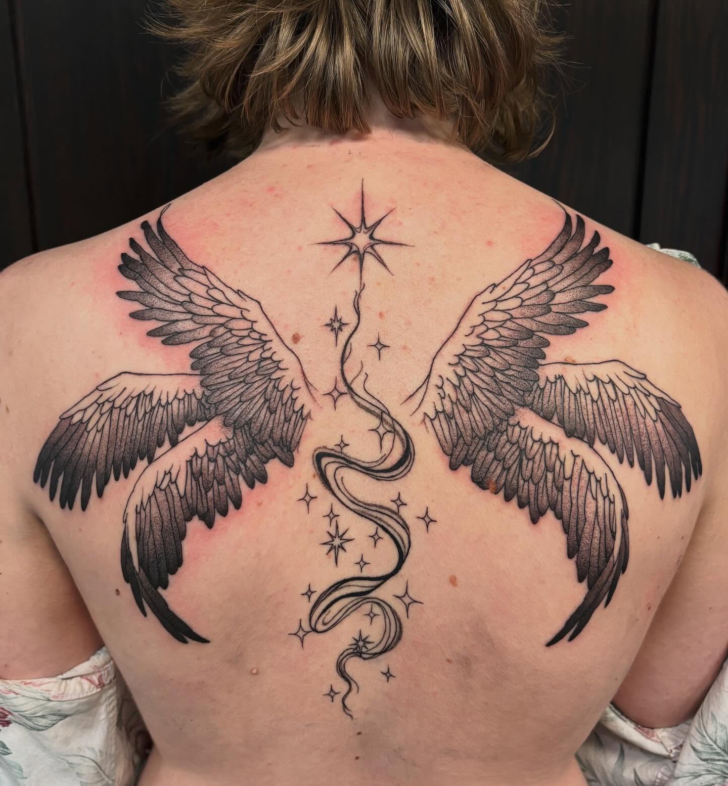 Angel wings realism tattoo on the back by kane