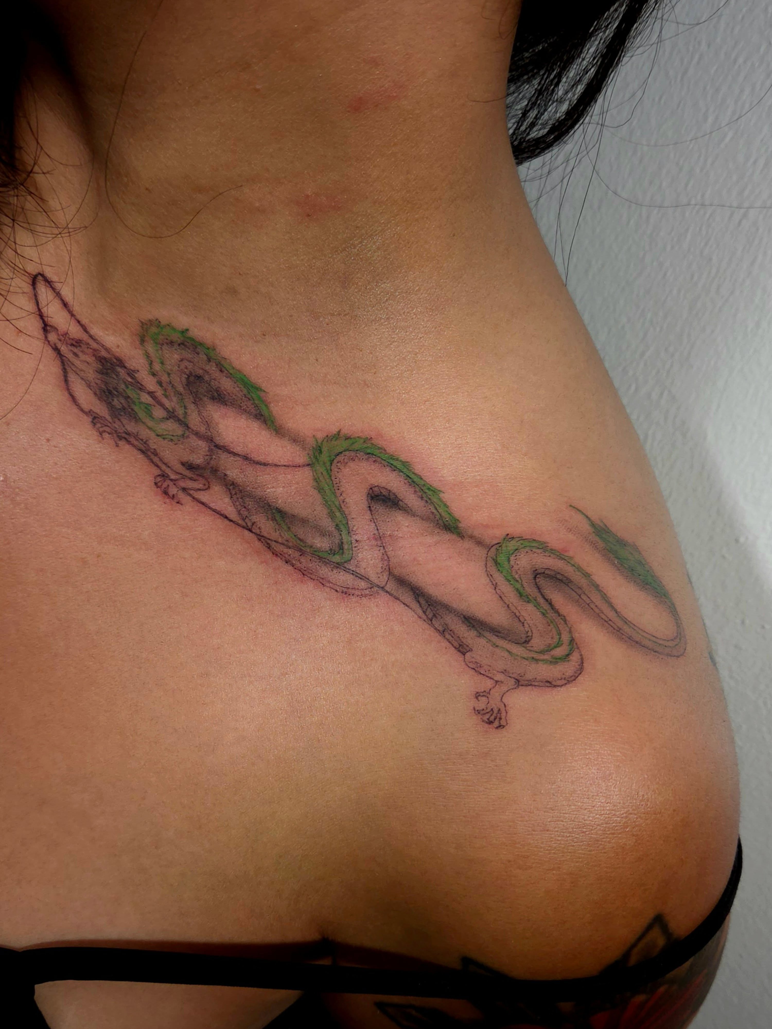 Dragon black and grey tattoo on the shoulder by ๐๐ฎ๐ป๐ฎ๐ถ๐, Charlotte, North Carolina