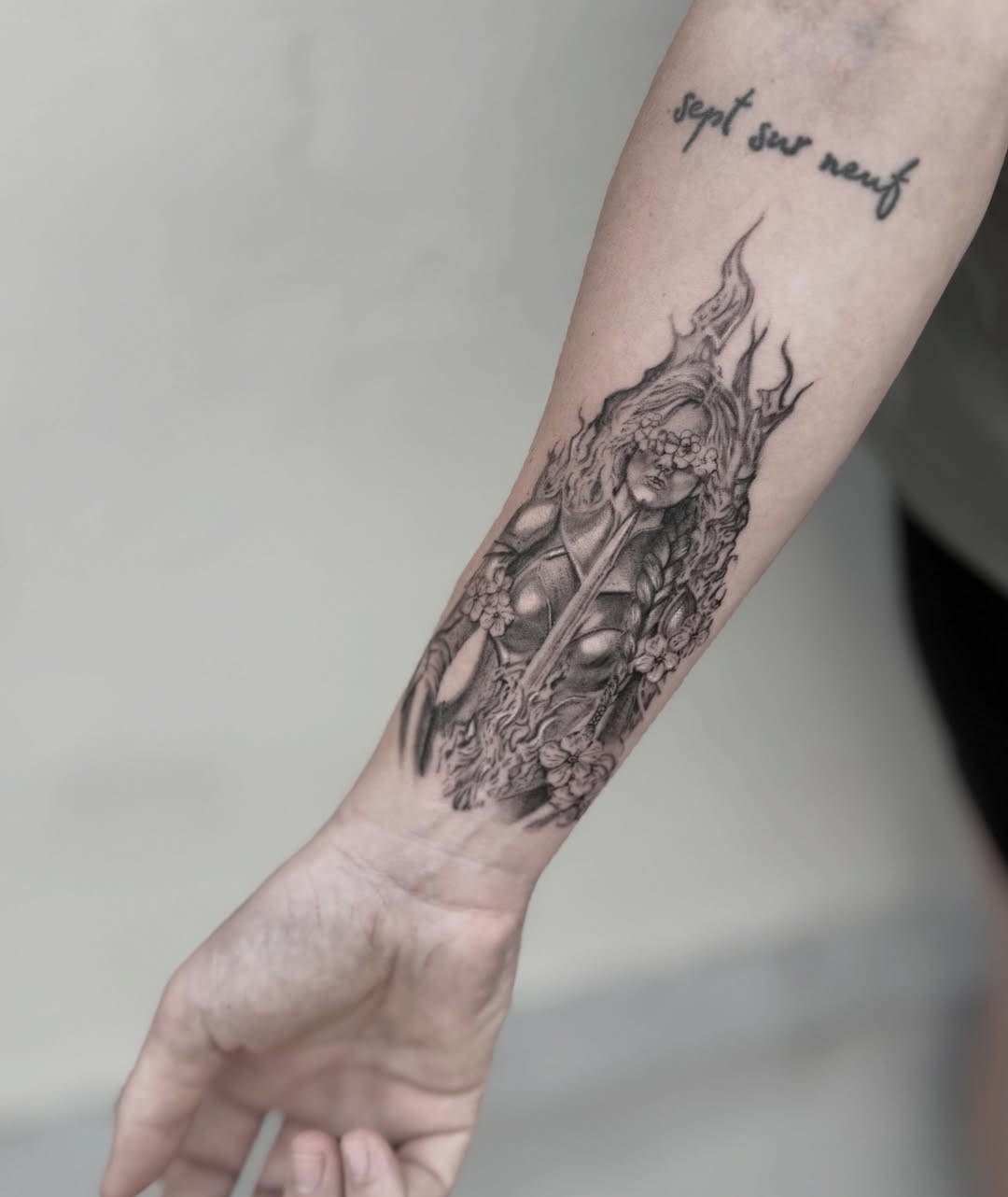 Flame-wrapped woman realism tattoo on the forearm by Raleigh tattoo artist, Raleigh, North Carolina