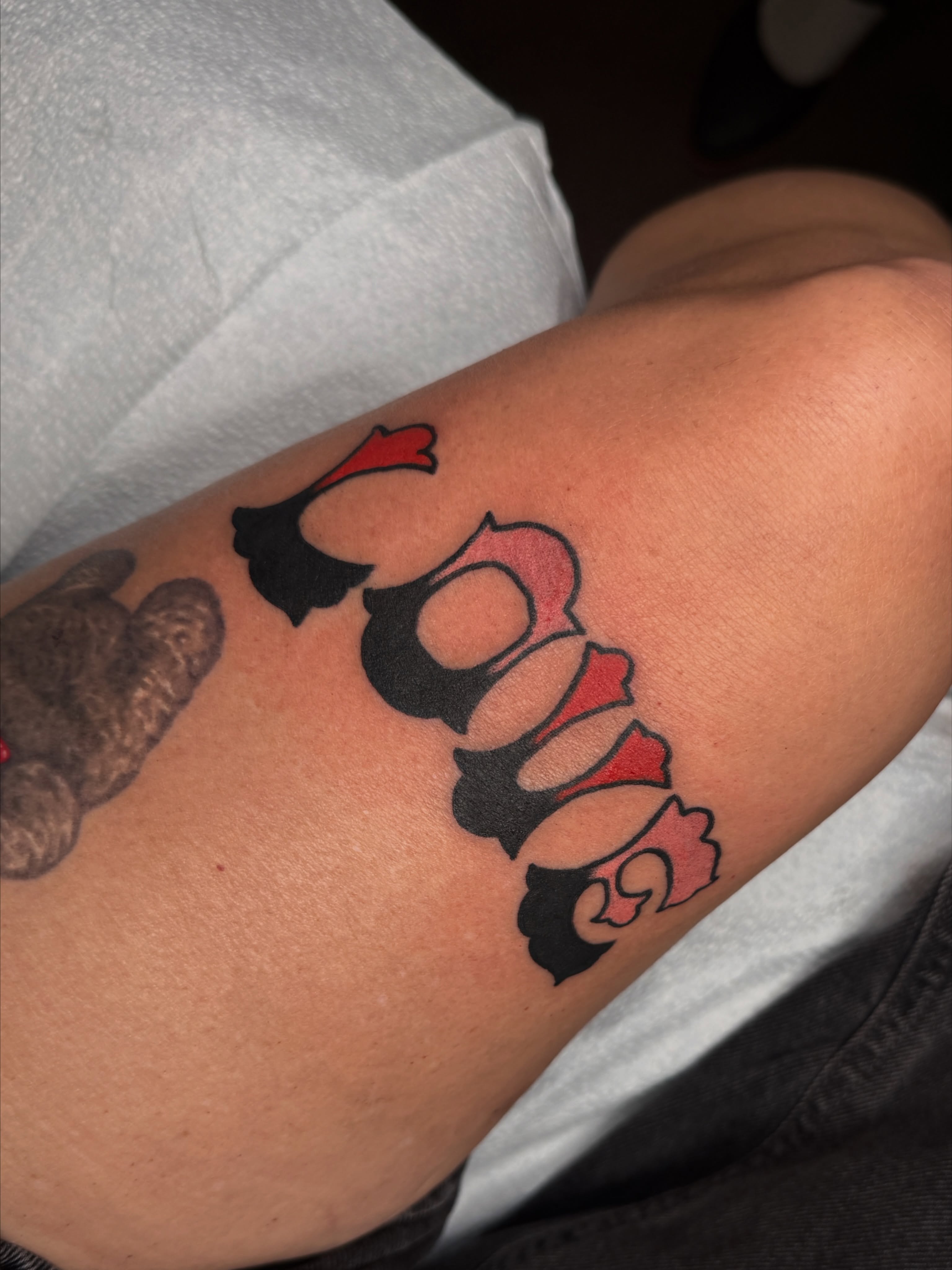 Script lettering lettering script tattoo on the upper arm by lily gustave i tattoo