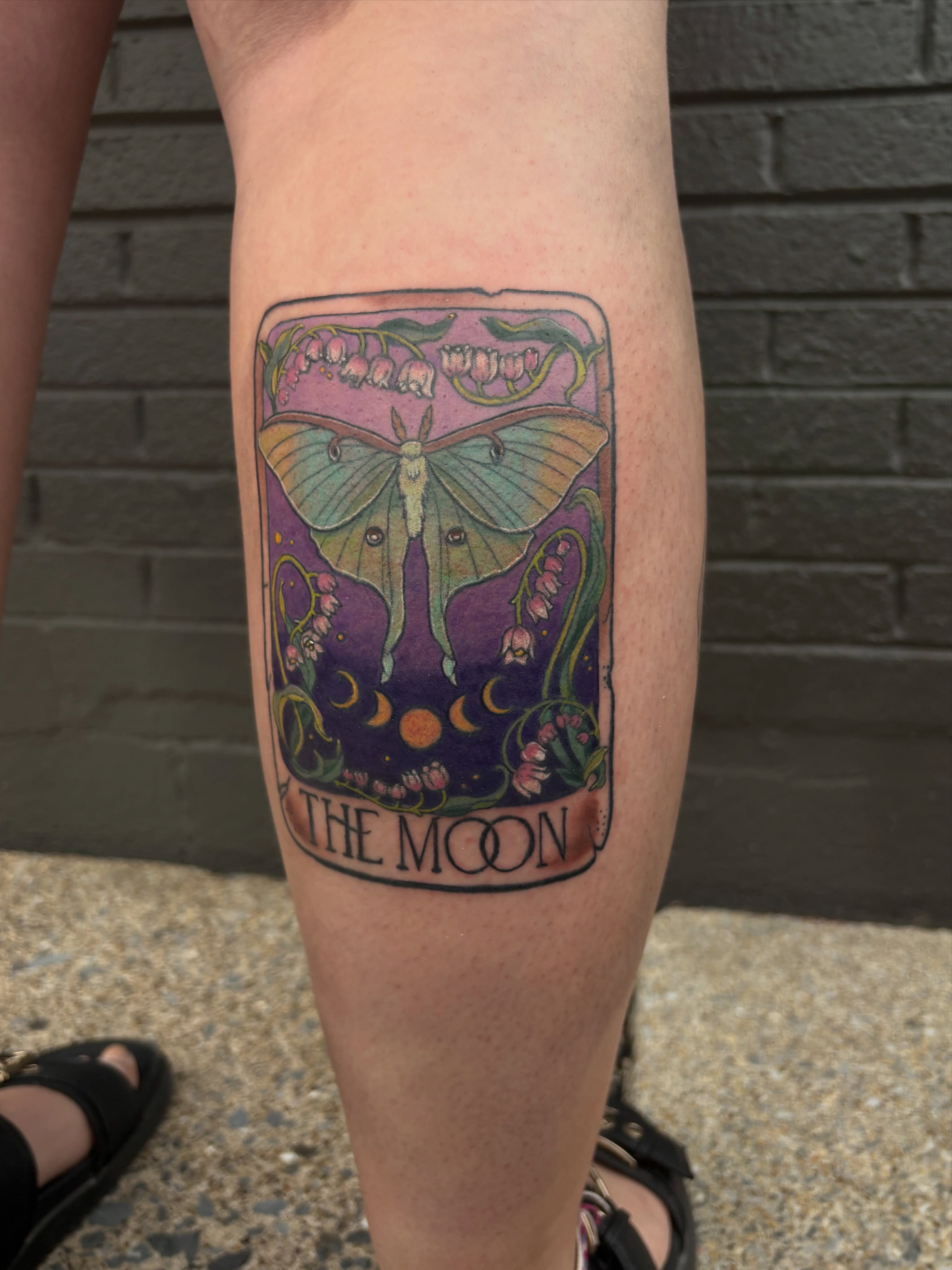 The moon illustrative tattoo on the forearm by Bekah Smith