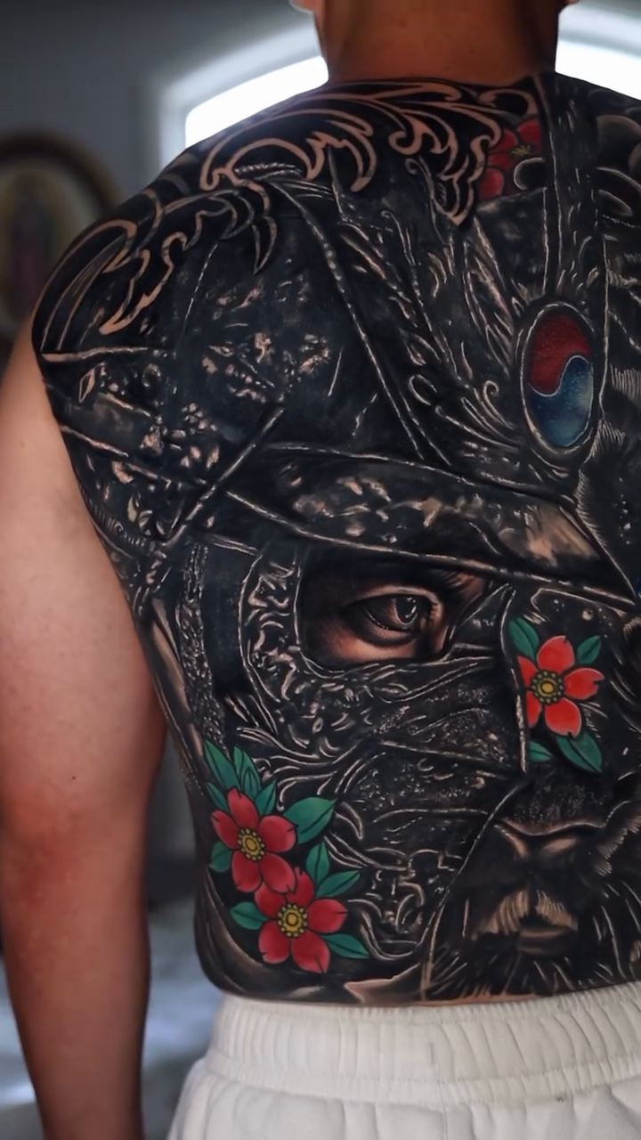 Samurai warrior mask with floral elements Japanese tattoo on the back by Insight Ink Tattoo