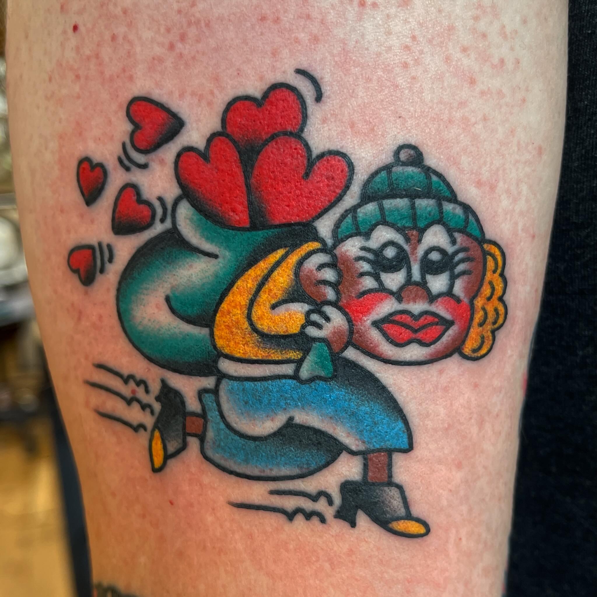 Clown with heart sack American traditional tattoo on the forearm by Spencer Reisbeck