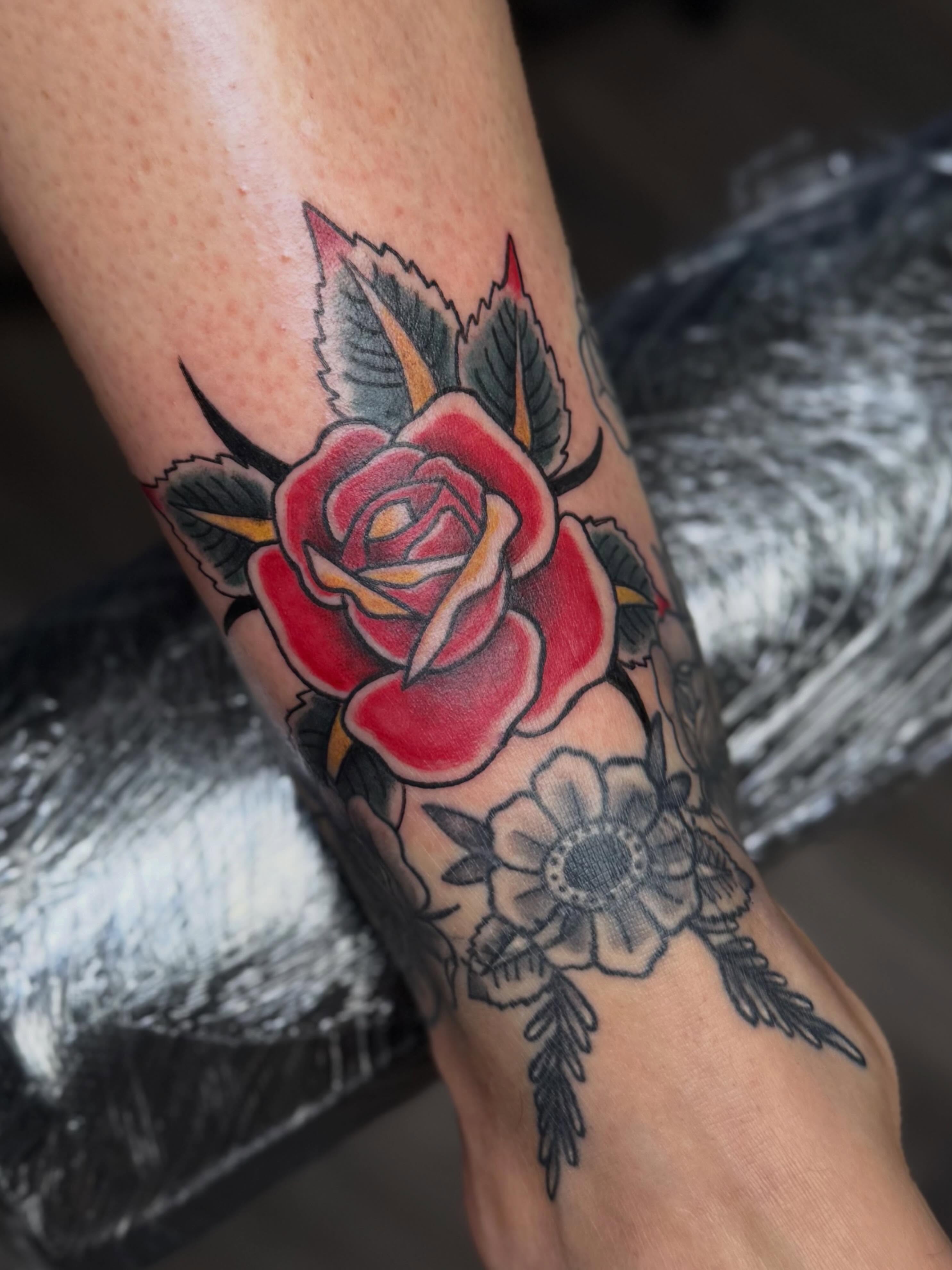 Rose American traditional tattoo on the forearm by βπ¬π―π’πΆ