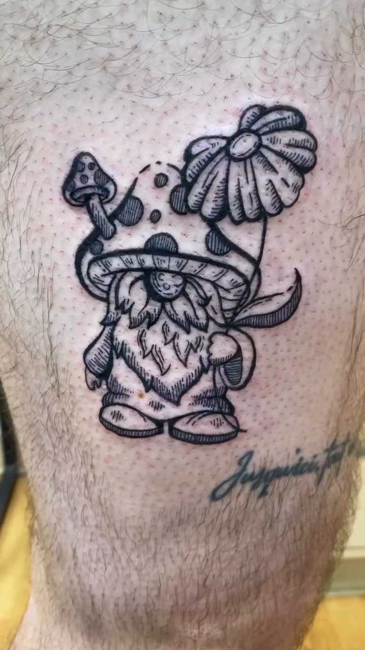 Gnome with mushroom hat dotwork tattoo on the thigh by Laura🦋