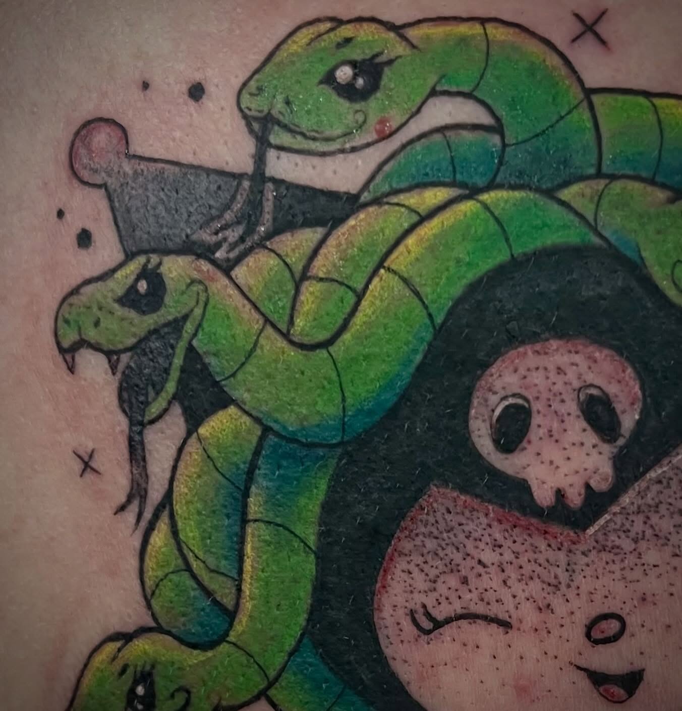 Snakes and skull American traditional tattoo on the torso by Freya Petersen