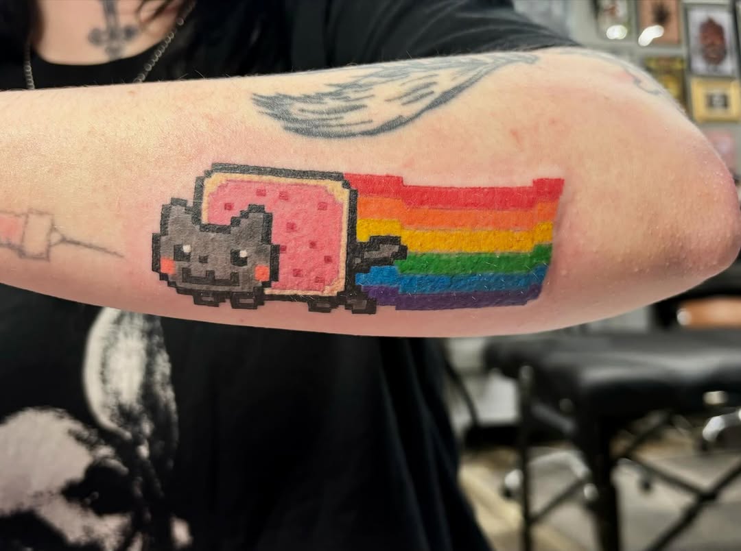 Nyan Cat with rainbow trail new school tattoo on the forearm by ✮ ✄ star ✮ ✄
