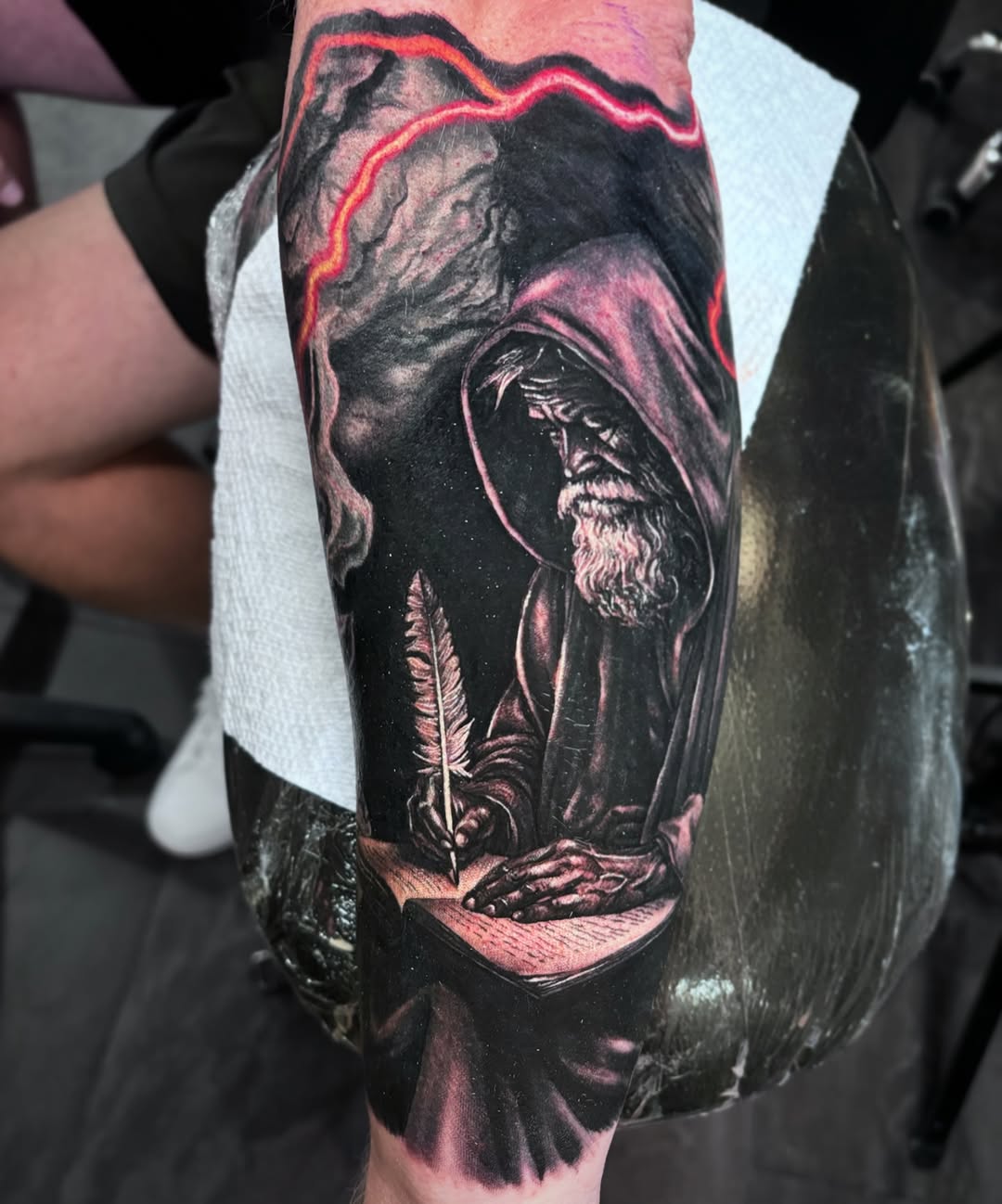 Wizard writing with feather quill surrealism tattoo on the forearm by 🦇𝖀𝖙𝖆𝖍🦇, Las Vegas, Nevada