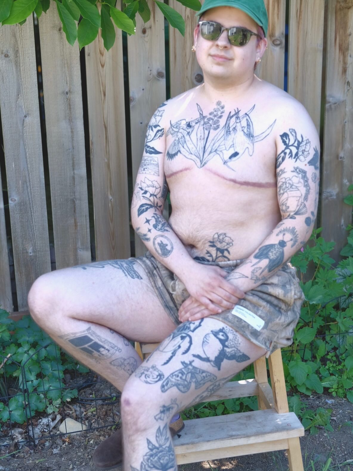 Bird and floral American traditional tattoo on the chest by Emily Rose Lumsdaine