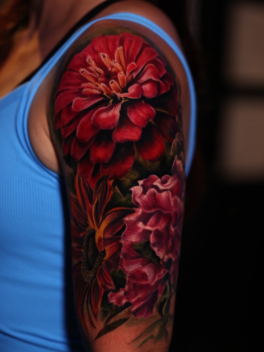 Flowers realism tattoo on the upper arm by Brandon Sontag