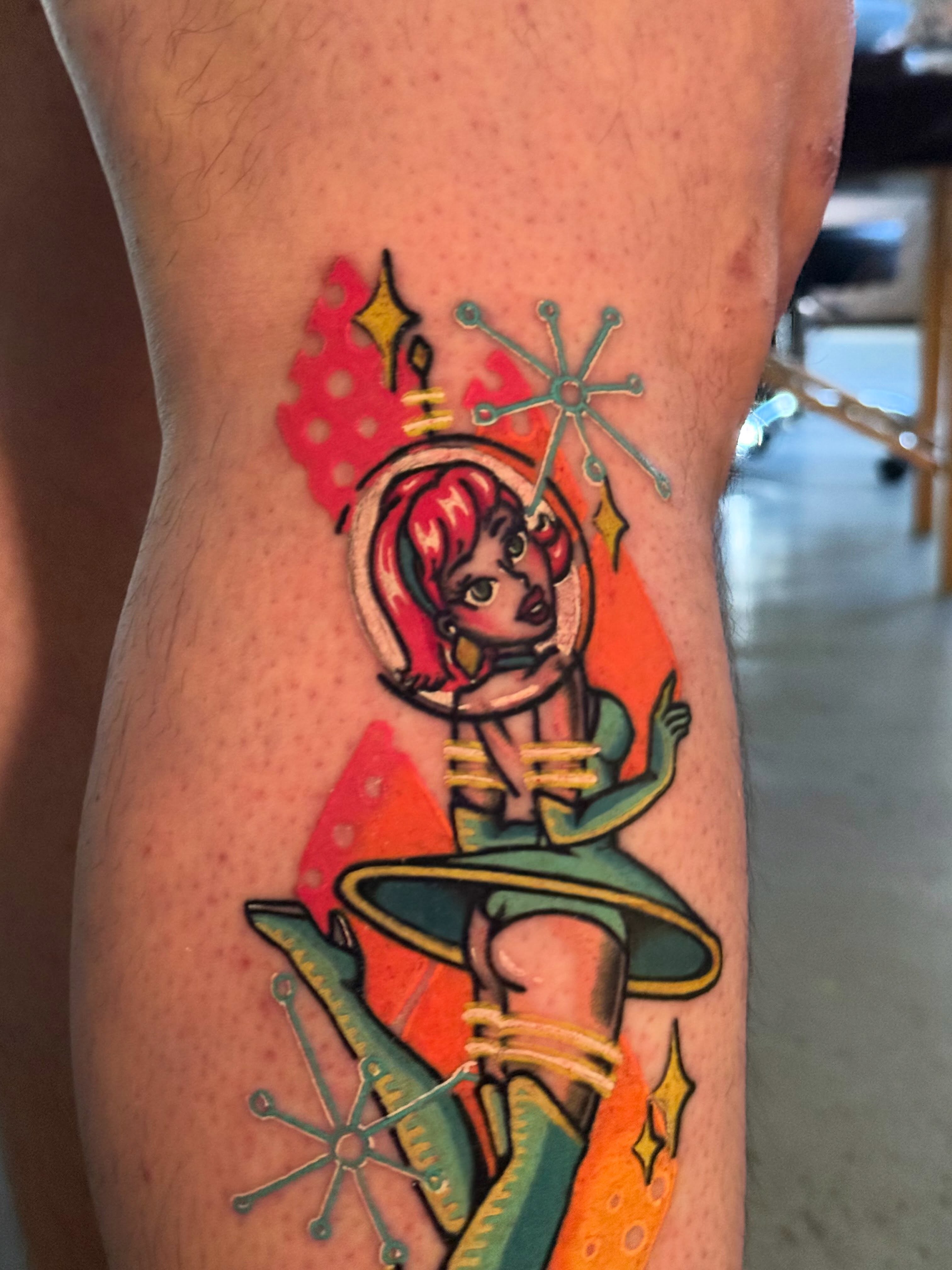 Astronaut pin-up girl new school tattoo on the thigh by Mackz