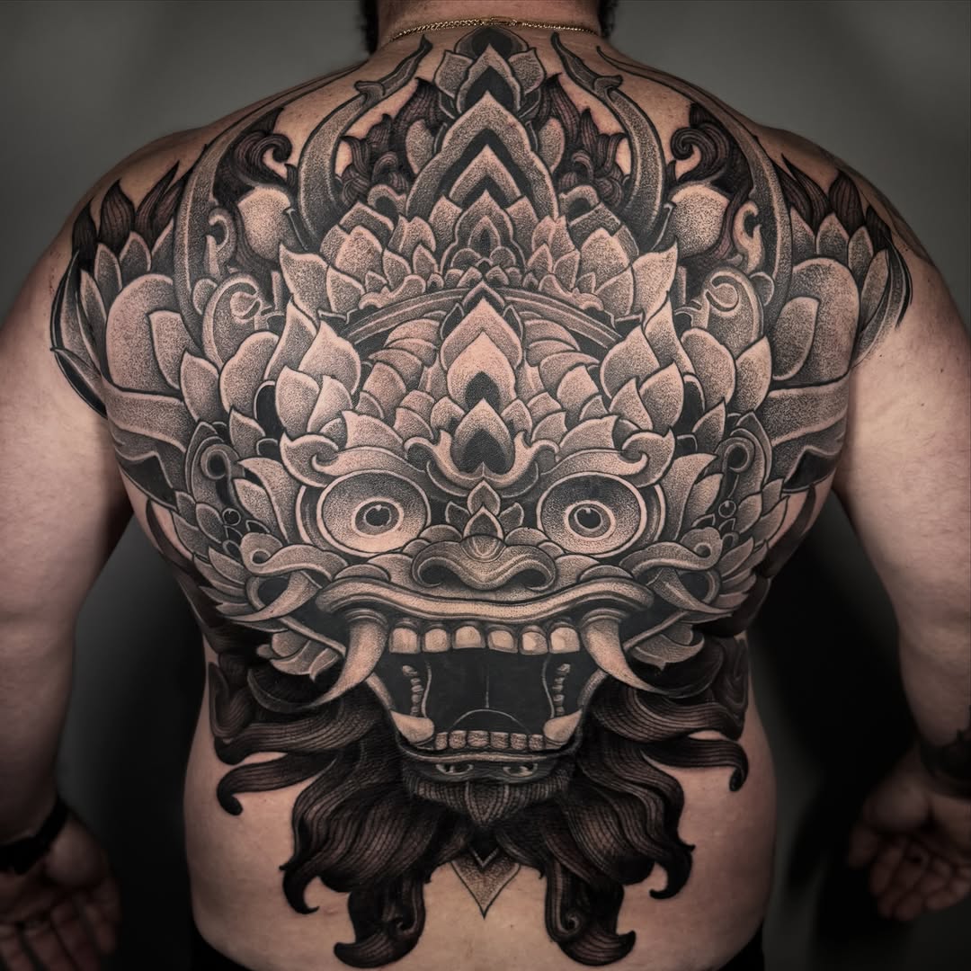 Balinese demon mask geometric tattoo on the back by miami tattoo artist