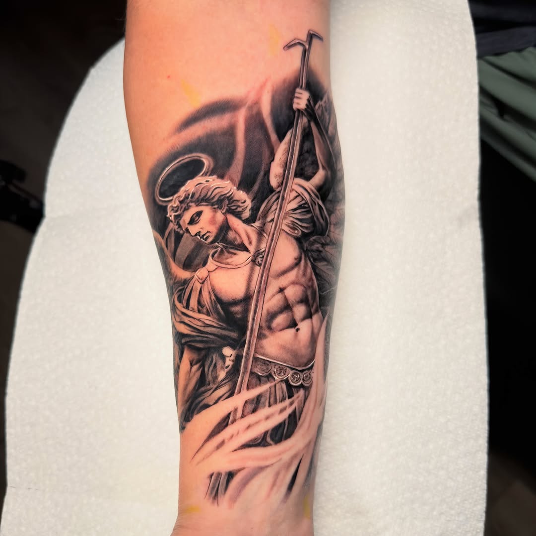 Archangel Michael realism tattoo on the forearm by Justin Hay