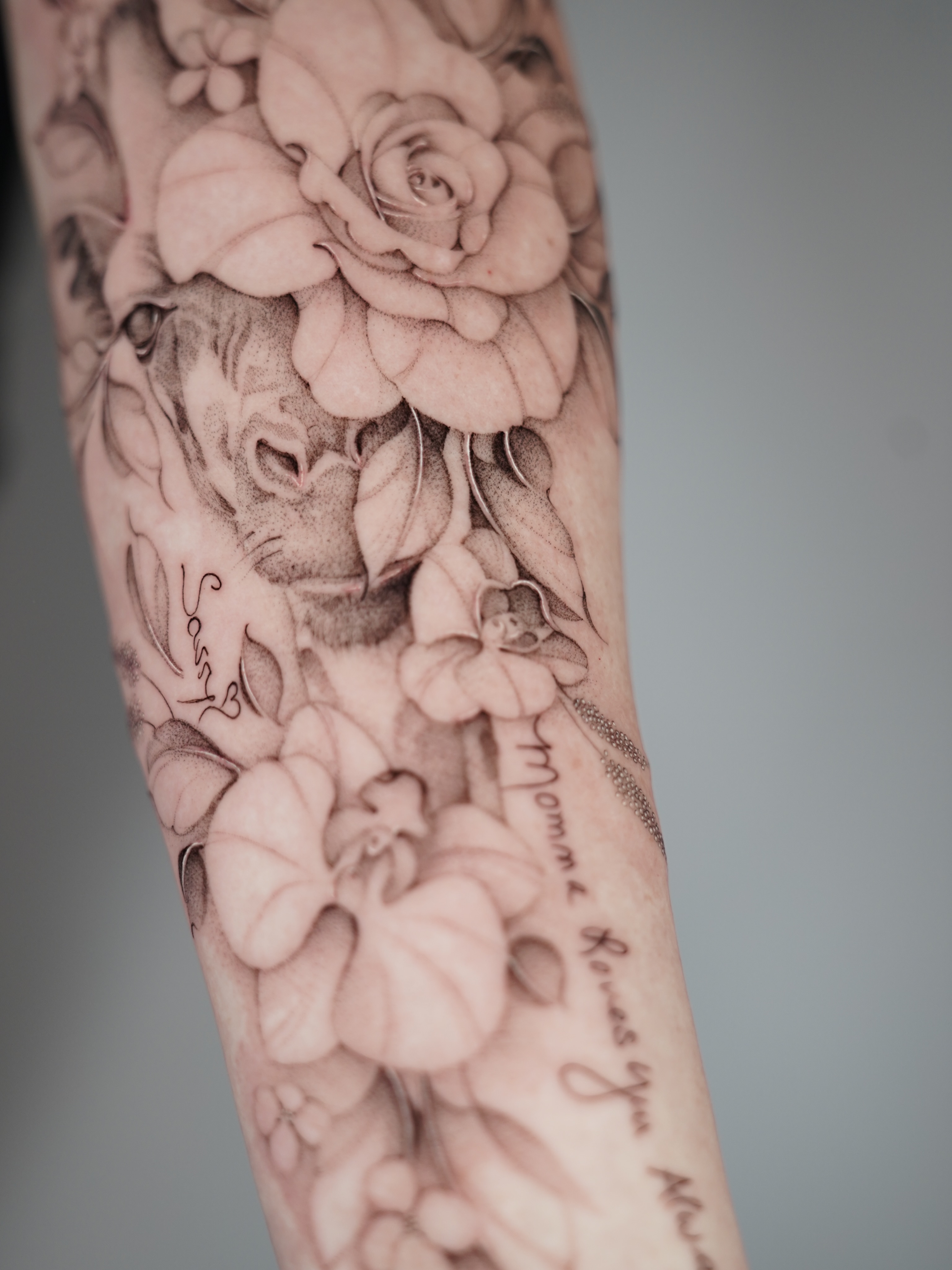 Floral arrangement realism tattoo on the forearm by Bel Fernandez