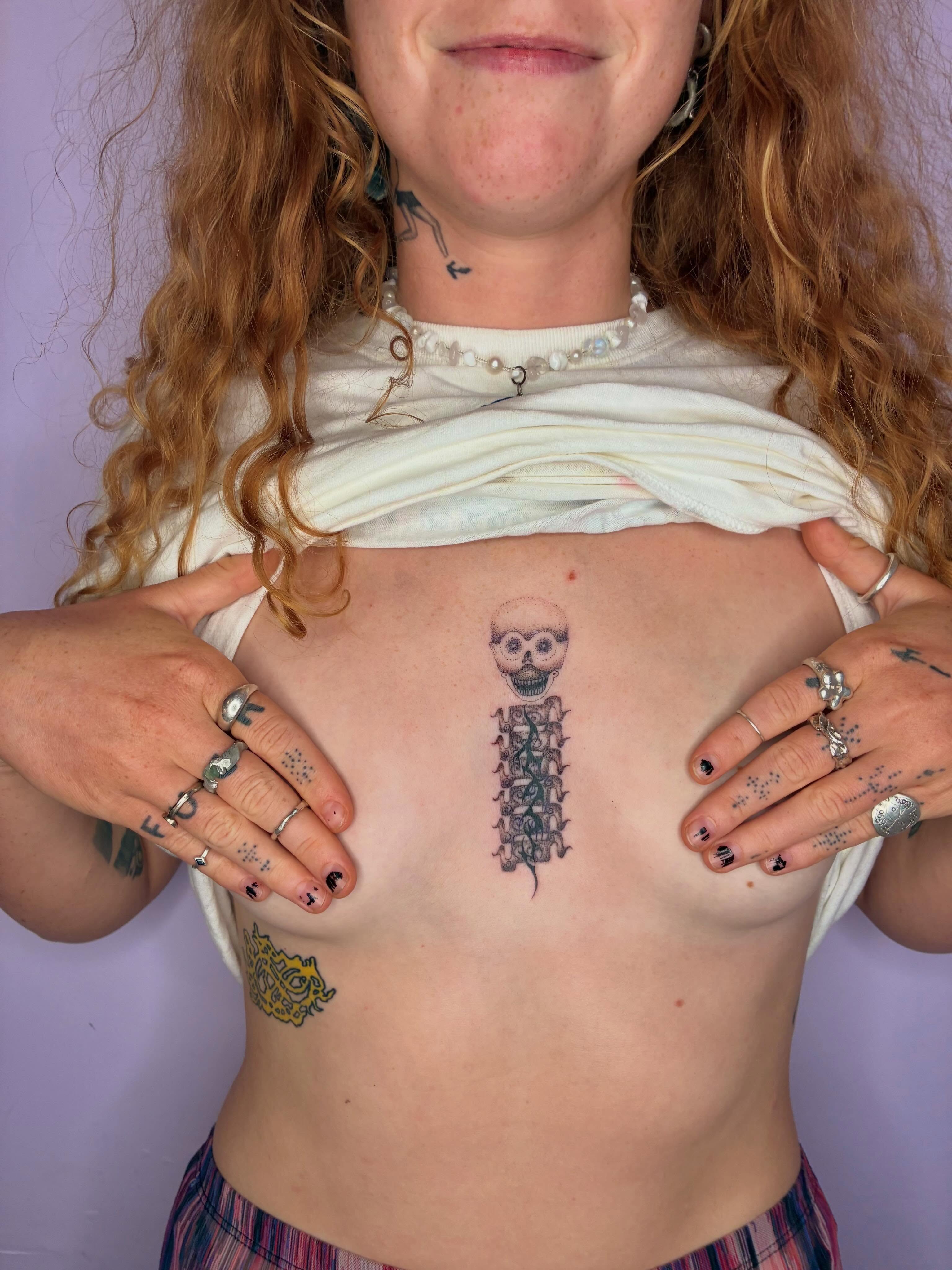 Spine with skull black and grey tattoo on the chest by ∘≁≀Gæish∀ ⍕ ◯⊂ⅇl⌾tl≀≁∘