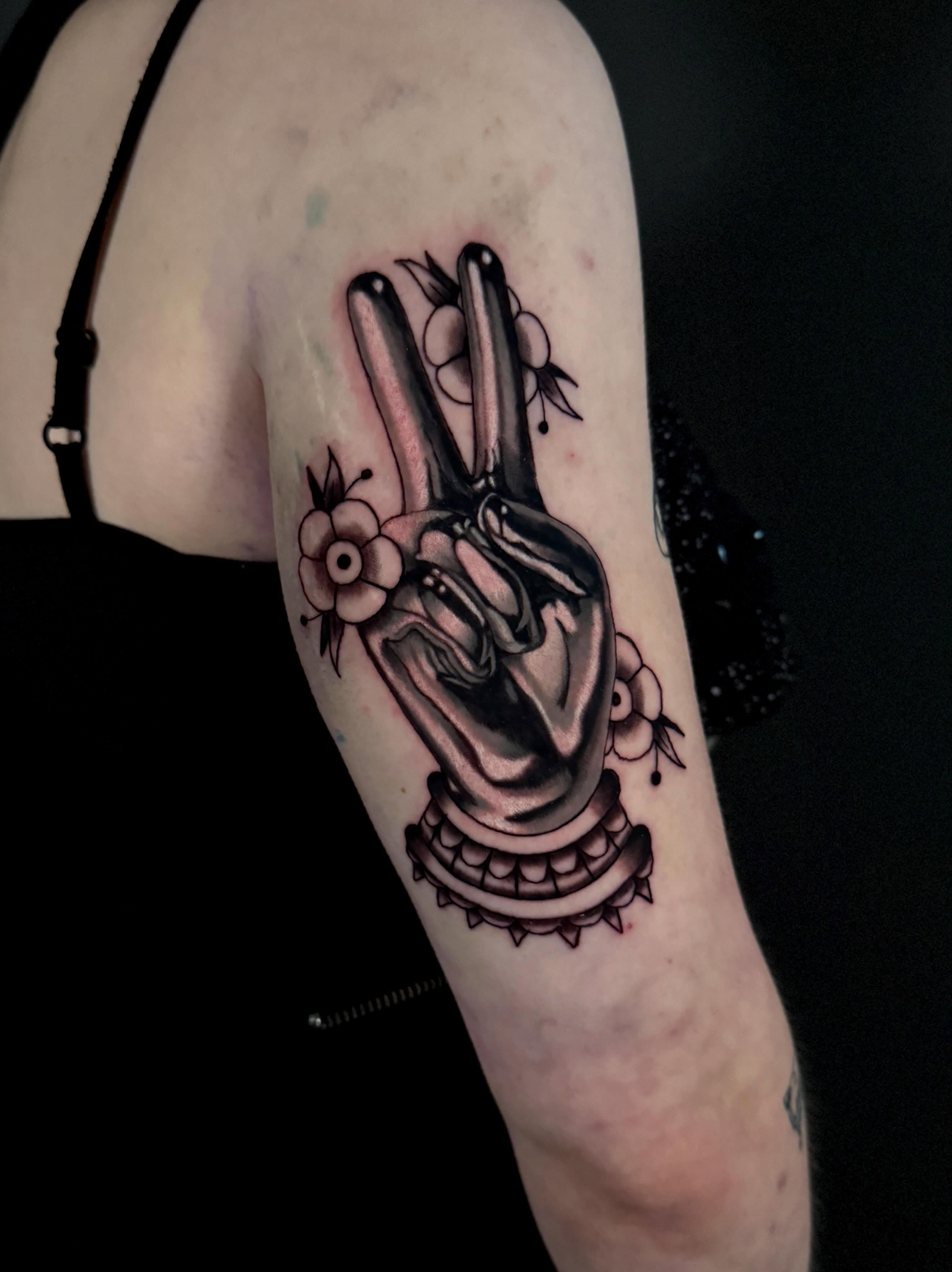 Peace sign American traditional tattoo on the forearm by Dallas Tattoo Artist