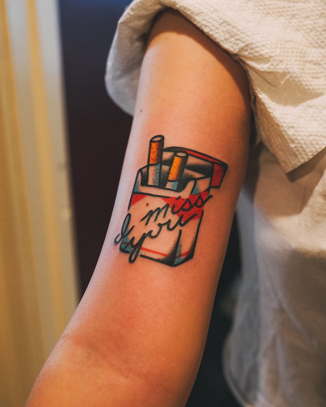 Cigarette pack American traditional tattoo on the forearm by 💚Phoenix Taylor💚-Fantasy Neotraditional