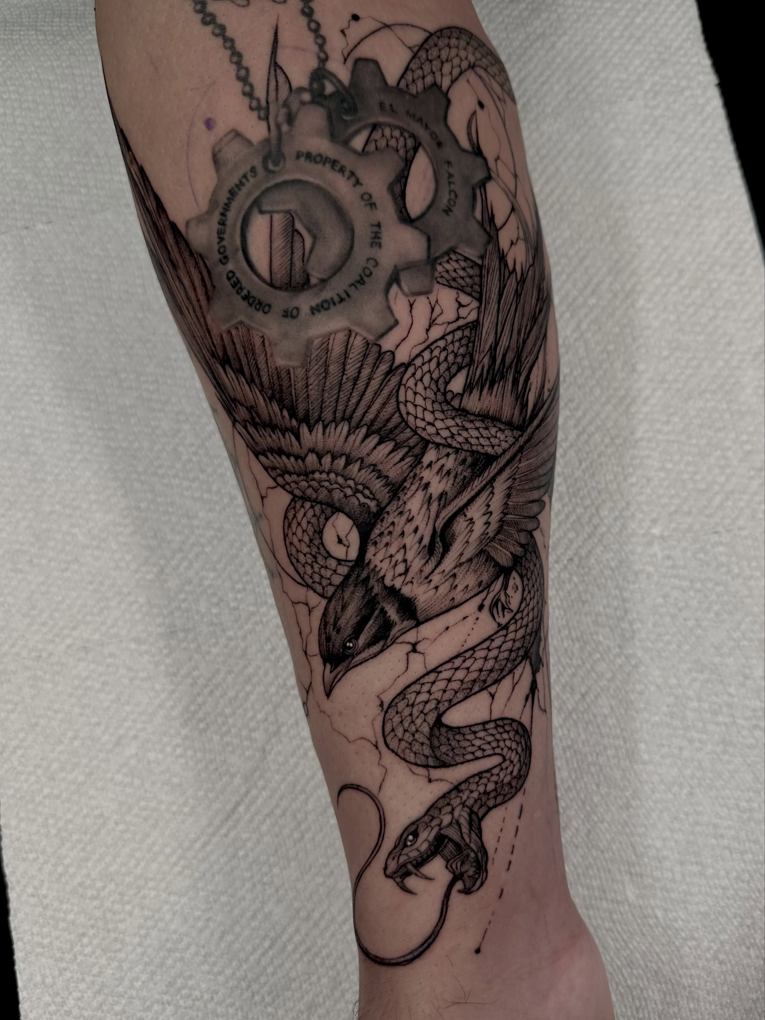 Snake and gear geometric tattoo on the forearm by Dayana✨