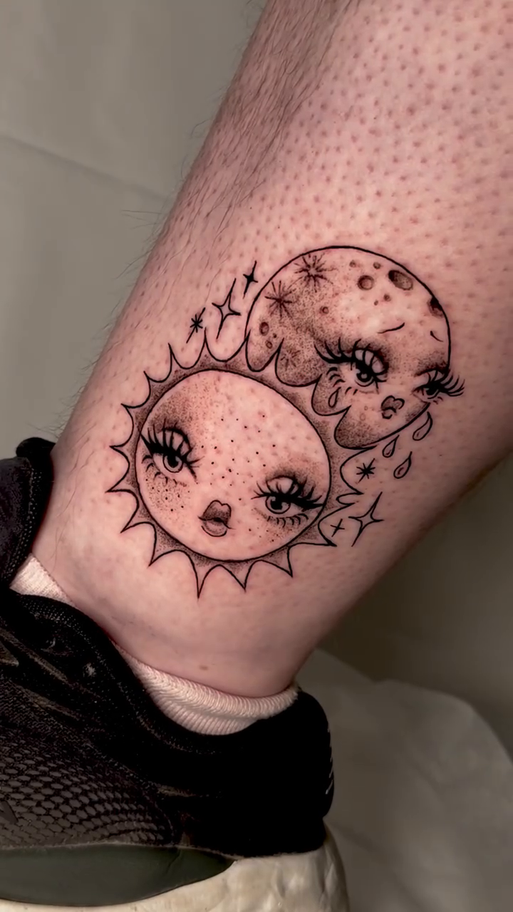 Sun and Moon faces new school tattoo on the forearm by tattooz by megz