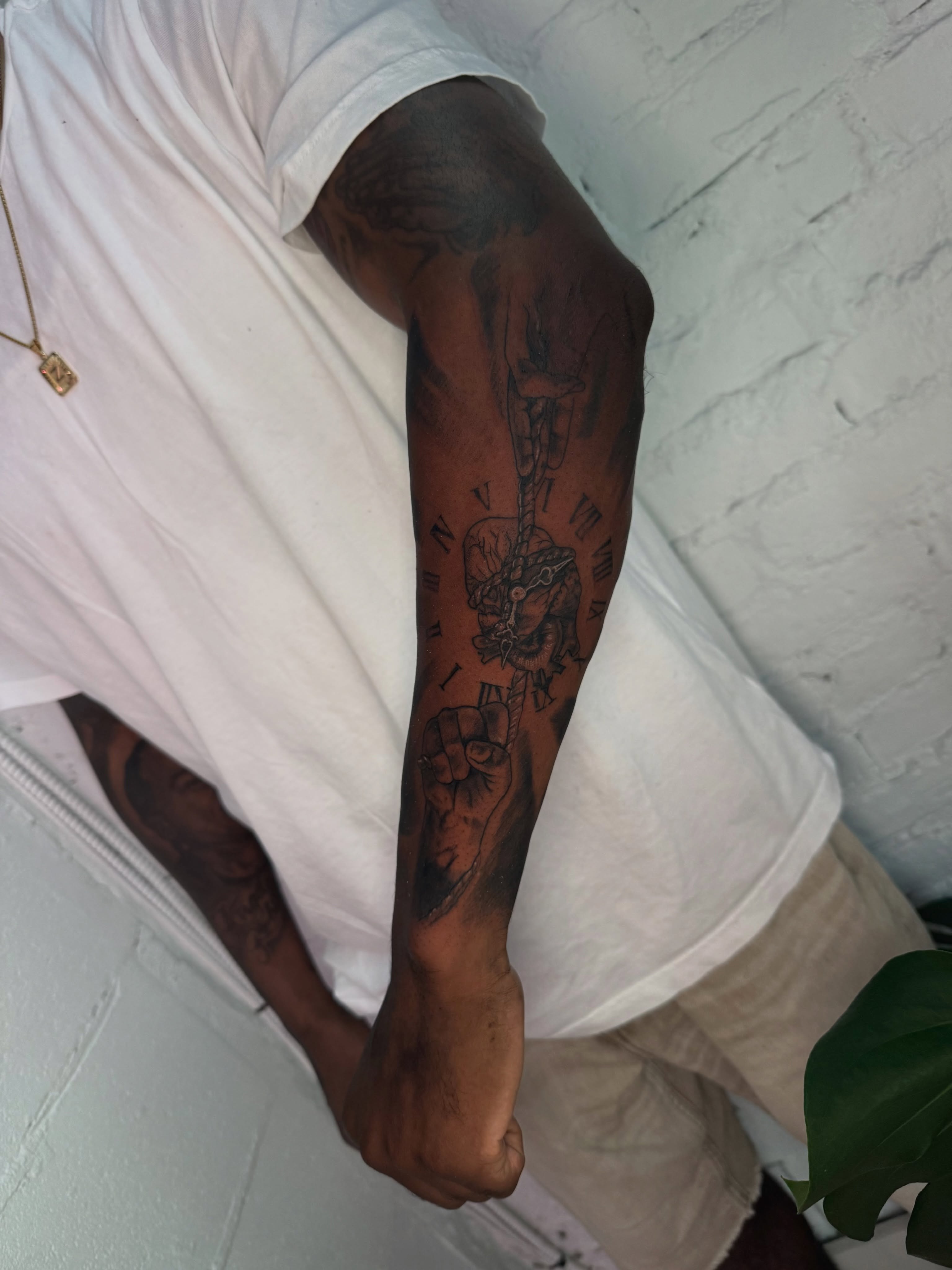 Clock and hand black and grey tattoo on the forearm by Asia Rene Tattoos👑