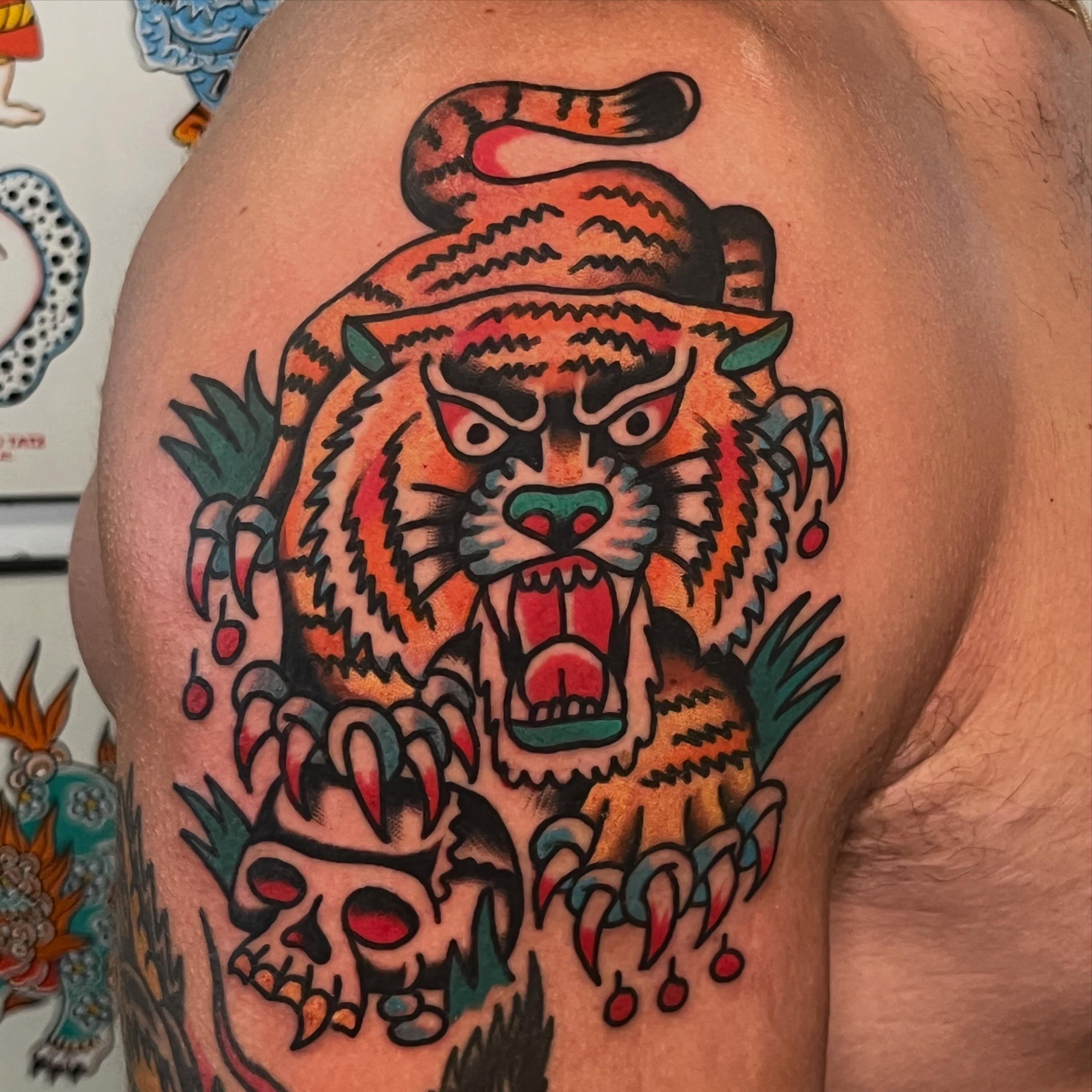 Tiger American traditional tattoo on the shoulder by Rizzo