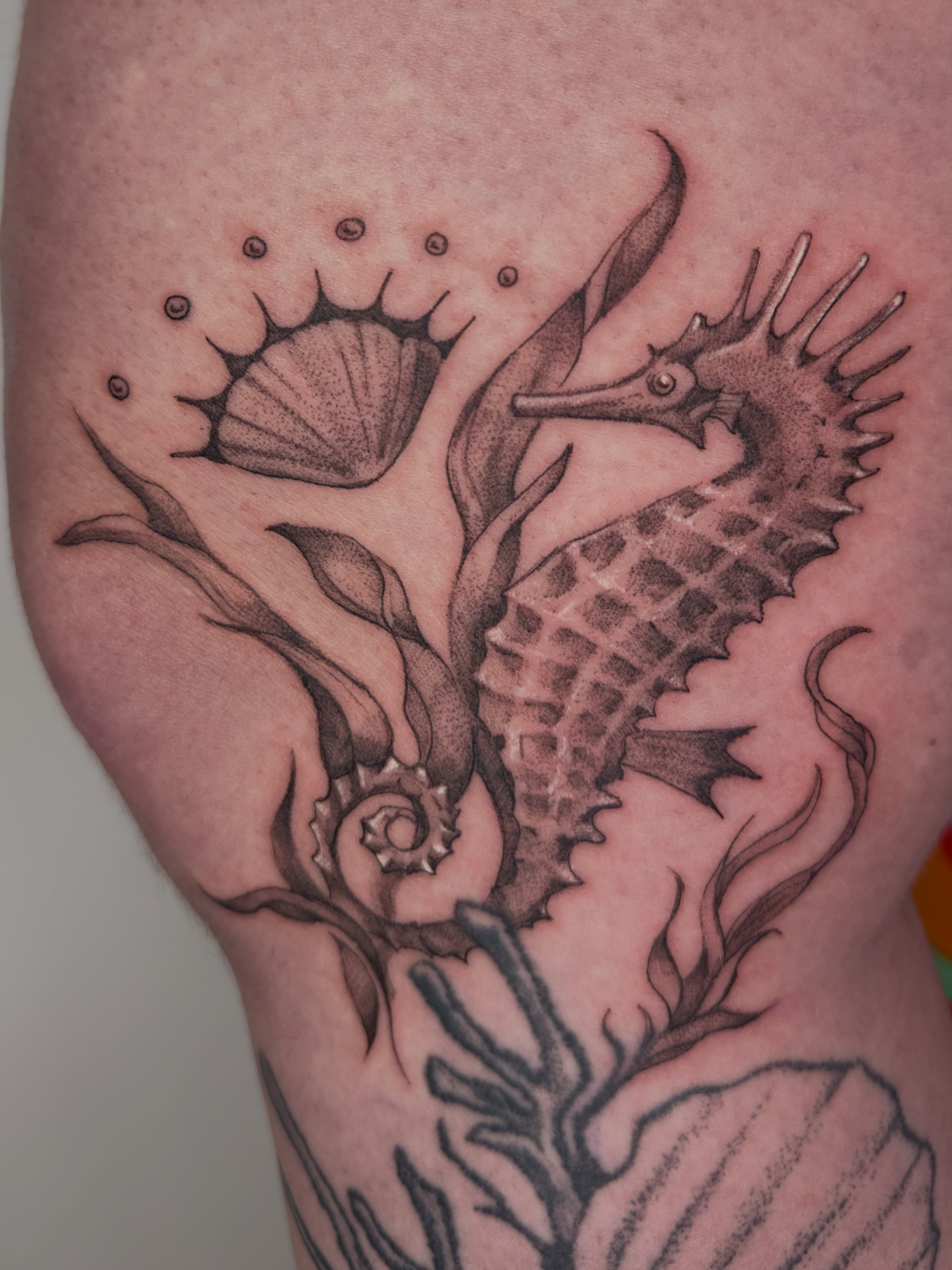 Seahorse black and grey tattoo on the thigh by Sadie Spades Philly Tattoos