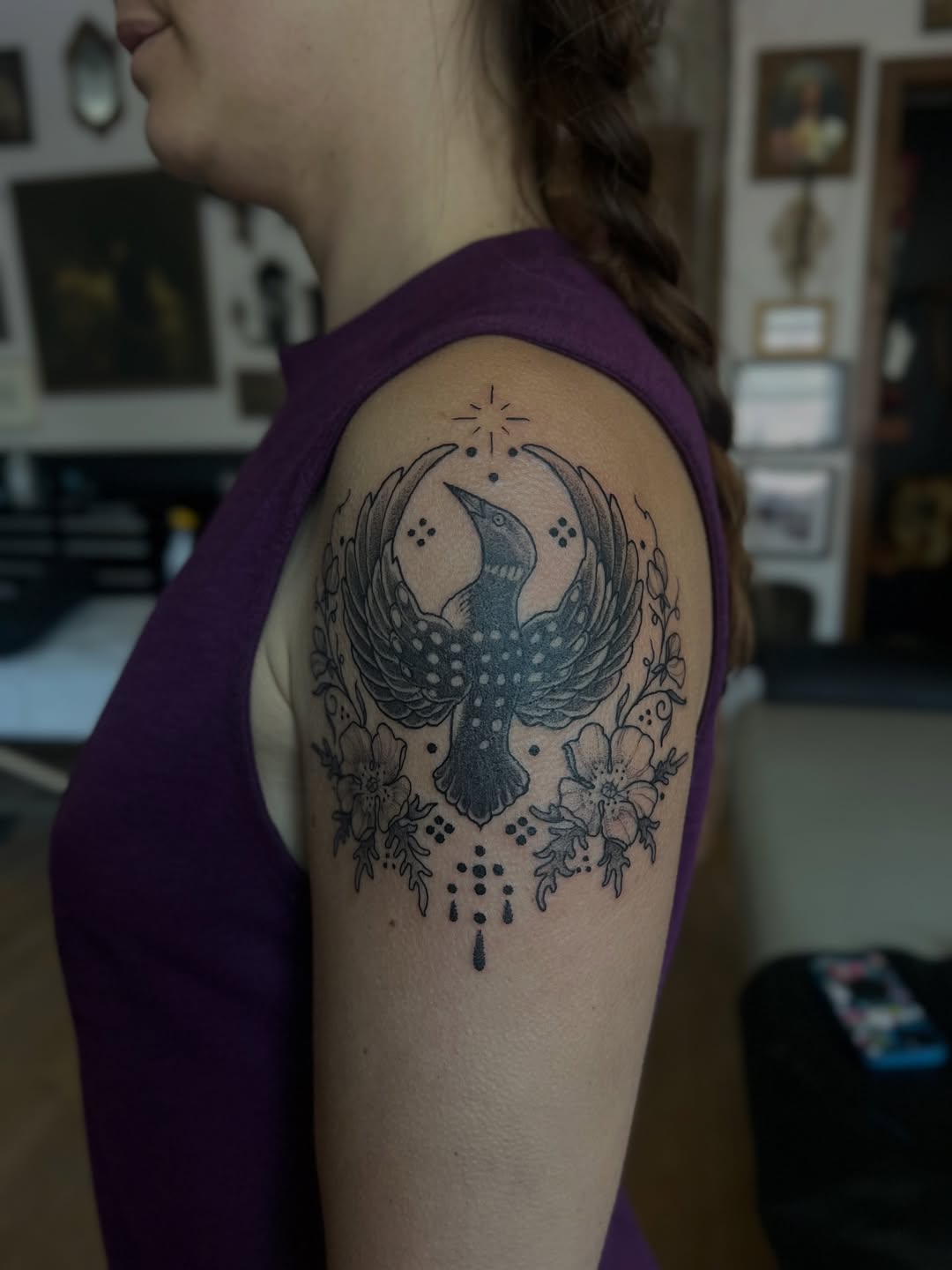 Bird with flowers fine line tattoo on the shoulder by Erinn Nicole