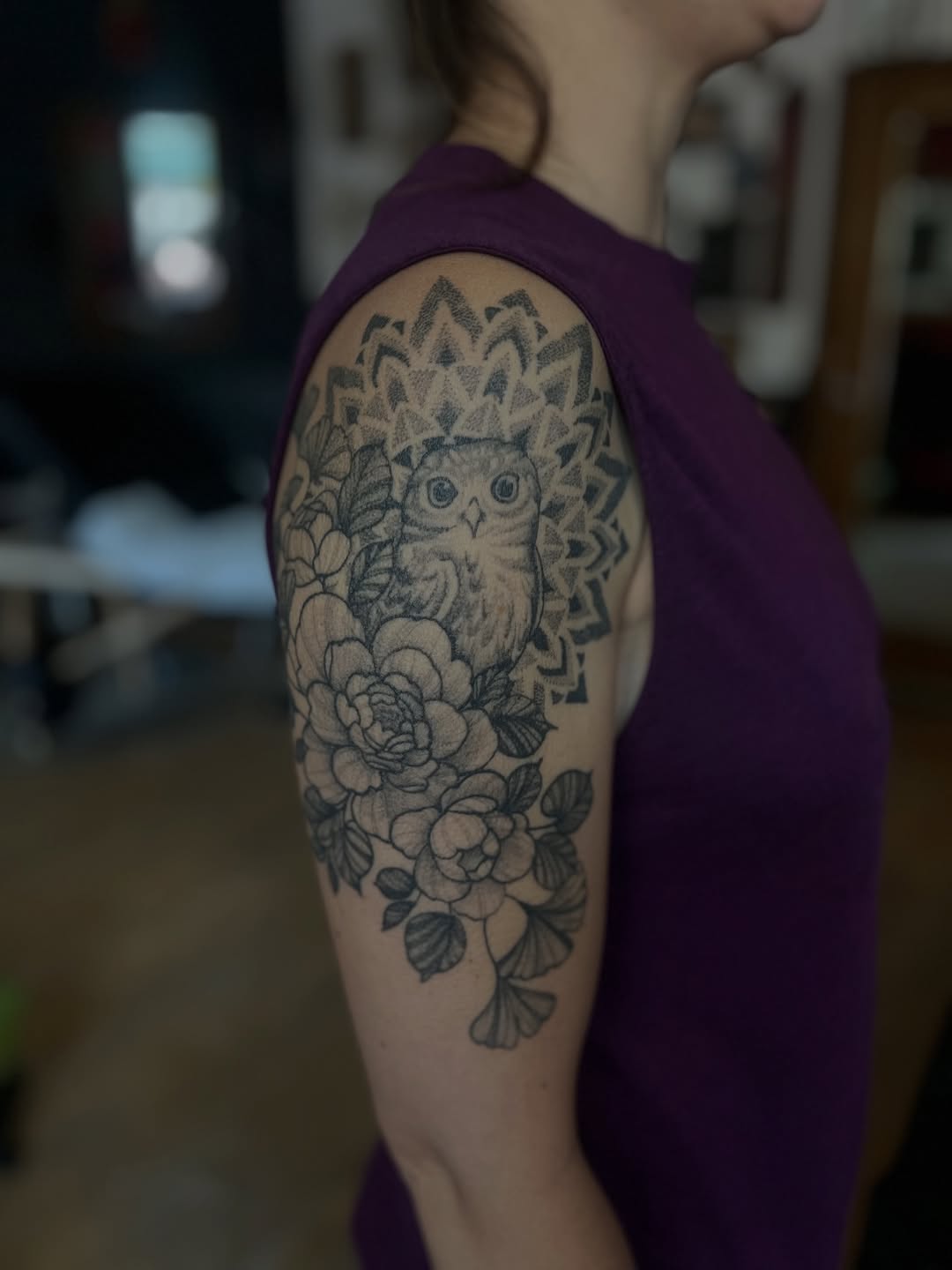 Owl with flowers and mandala ornamental tattoo on the upper arm by Erinn Nicole