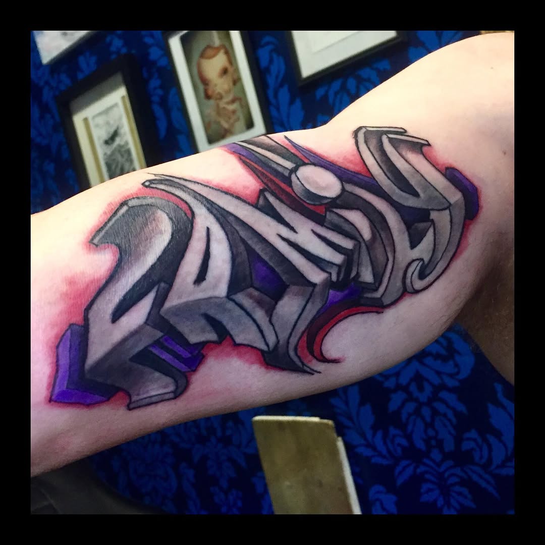 Graffiti lettering lettering tattoo on the forearm by Dharm, Denver, Colorado