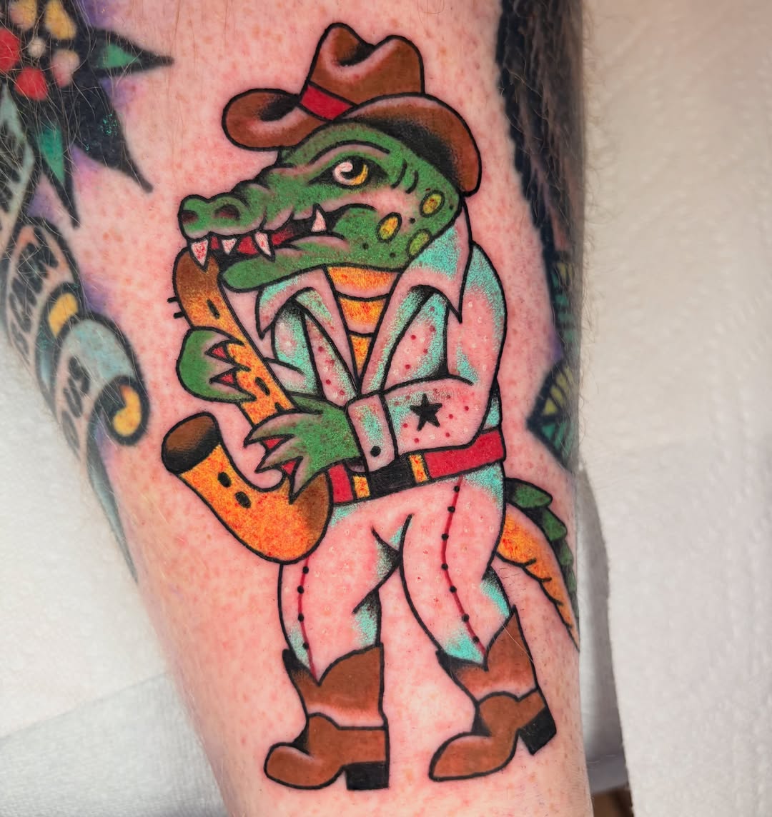 Alligator cowboy American traditional tattoo on the forearm by ๐ต๐๐๐๐ ๐ฎ๐๐๐๐๐๐, New Orleans, Louisiana