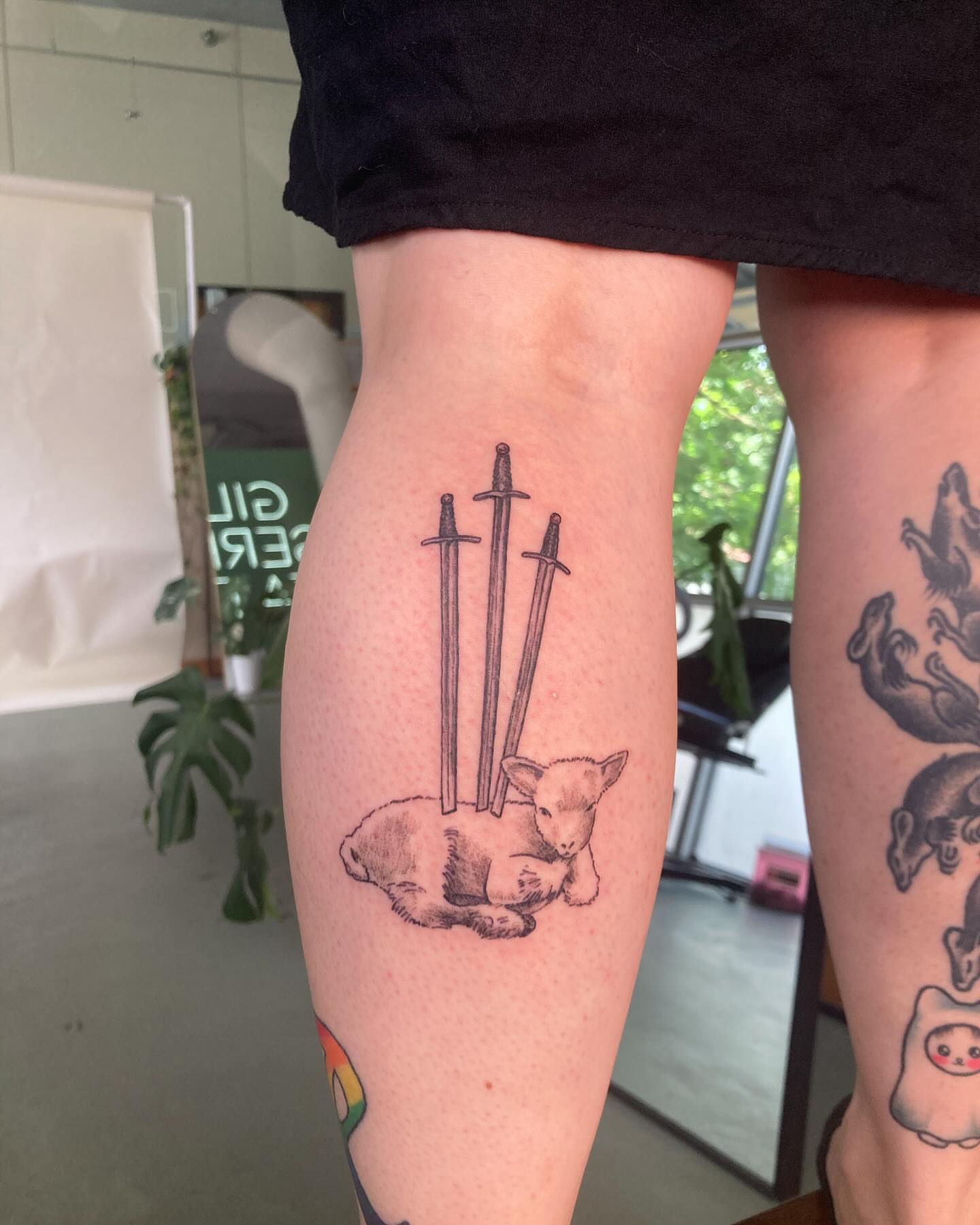 Cat and swords black and grey tattoo on the forearm by james <3