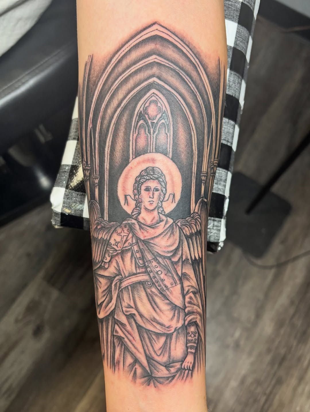 Angelic figure in gothic architecture realism tattoo on the forearm by ⚓️Jake