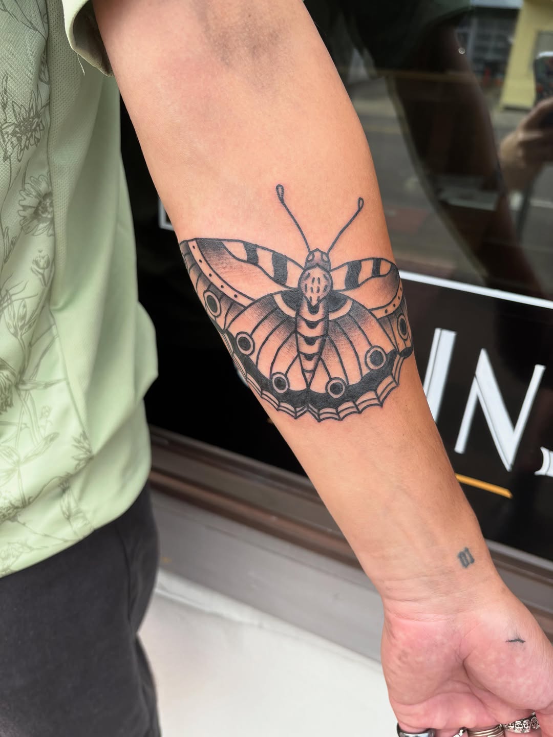 Butterfly fine line tattoo on the forearm by ellie