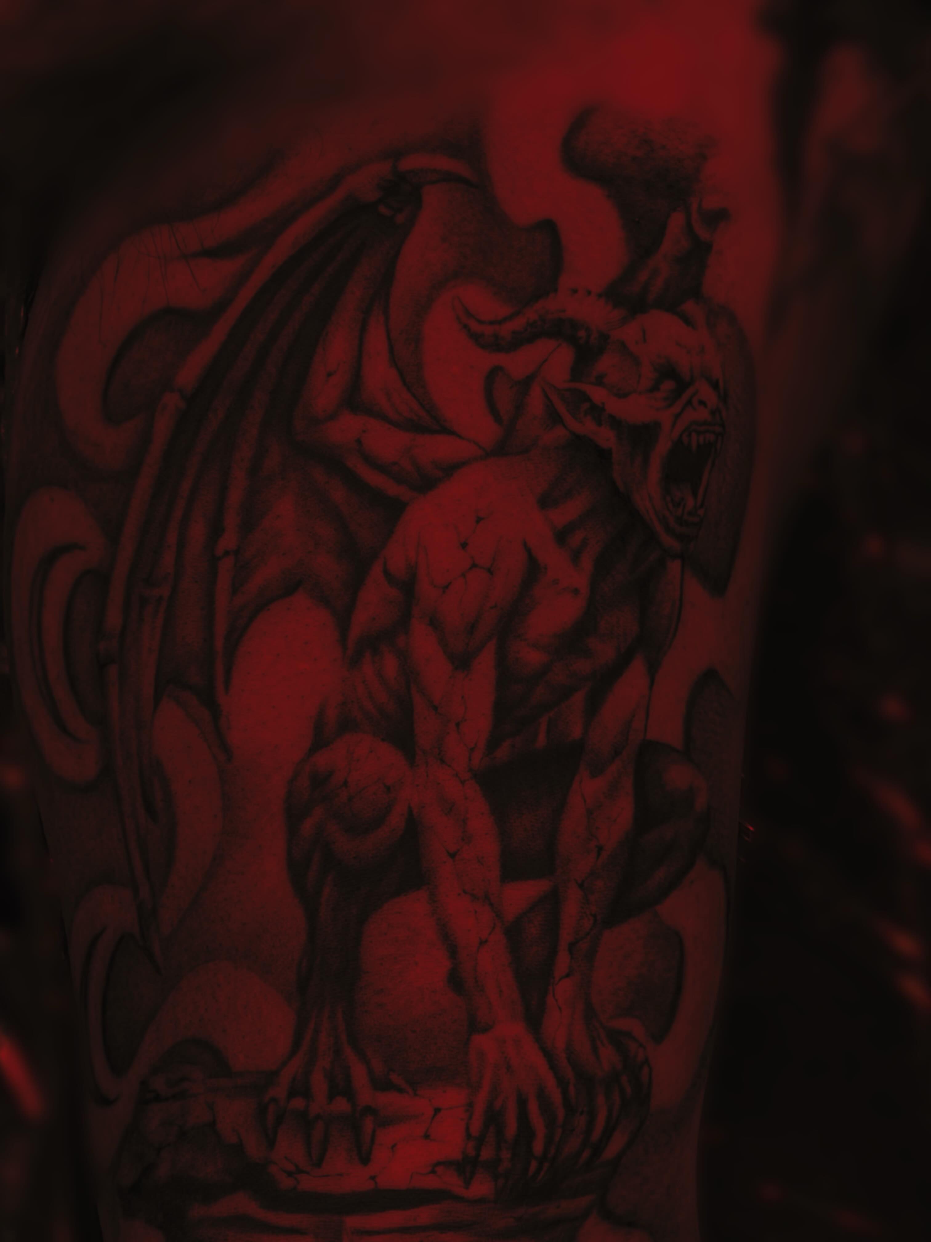 Demon dark realism tattoo on the forearm by Lissy Red