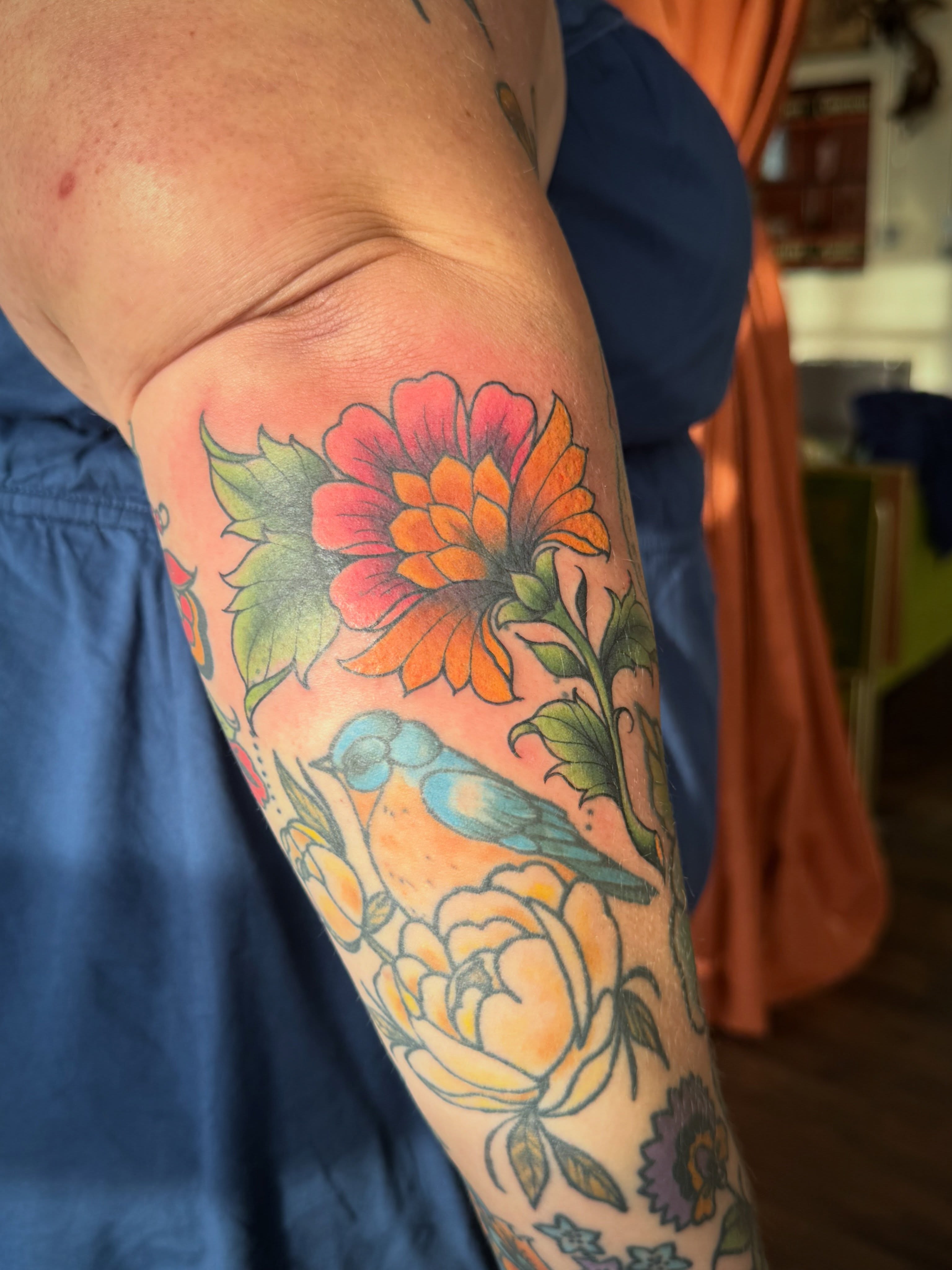 Floral arrangement with bird American traditional tattoo on the forearm by Alisa (Li) Affatato ๐ผ